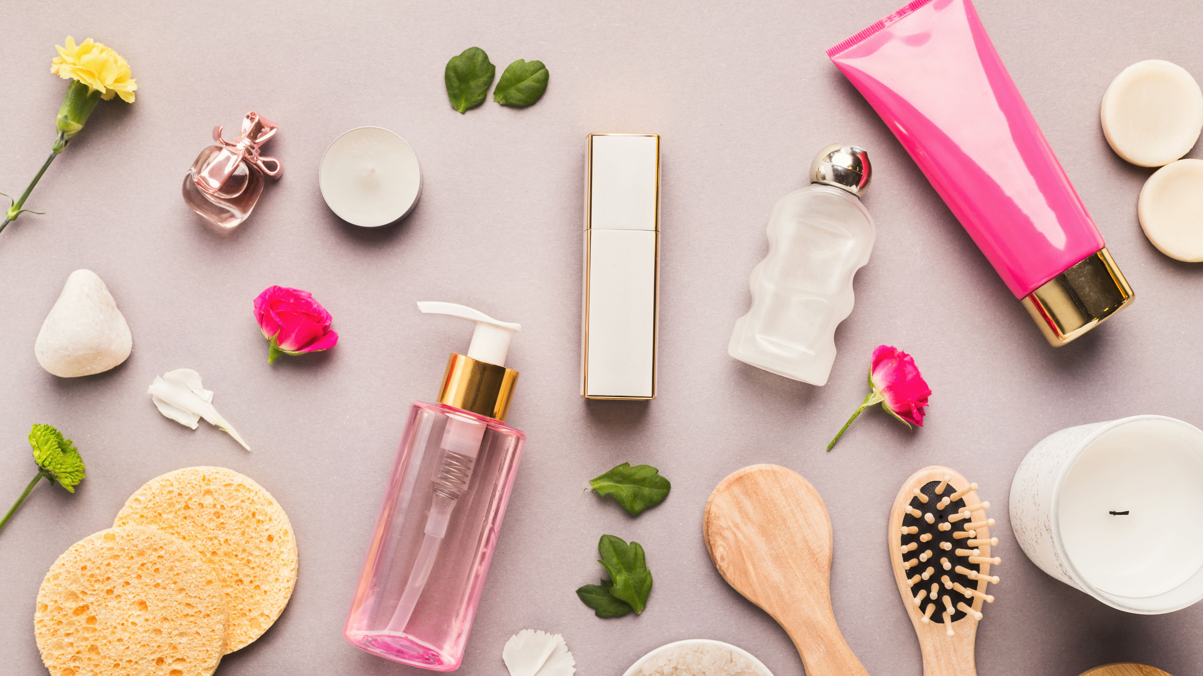 Natural cosmetics and spa essentials arranged on a neutral background.