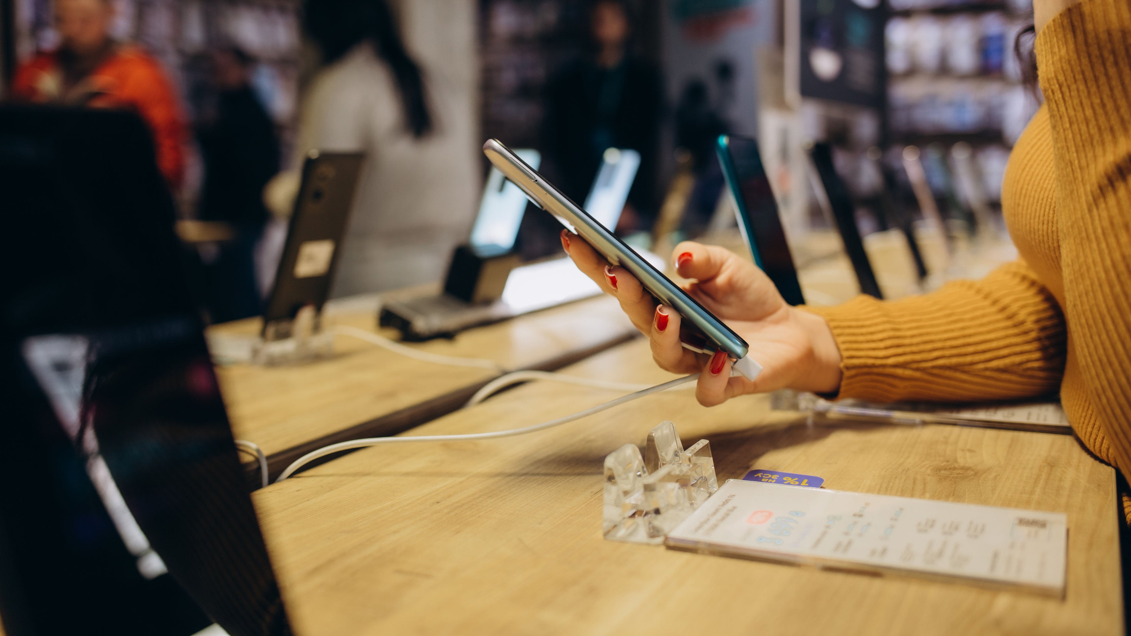 A person checking the new model smartphone