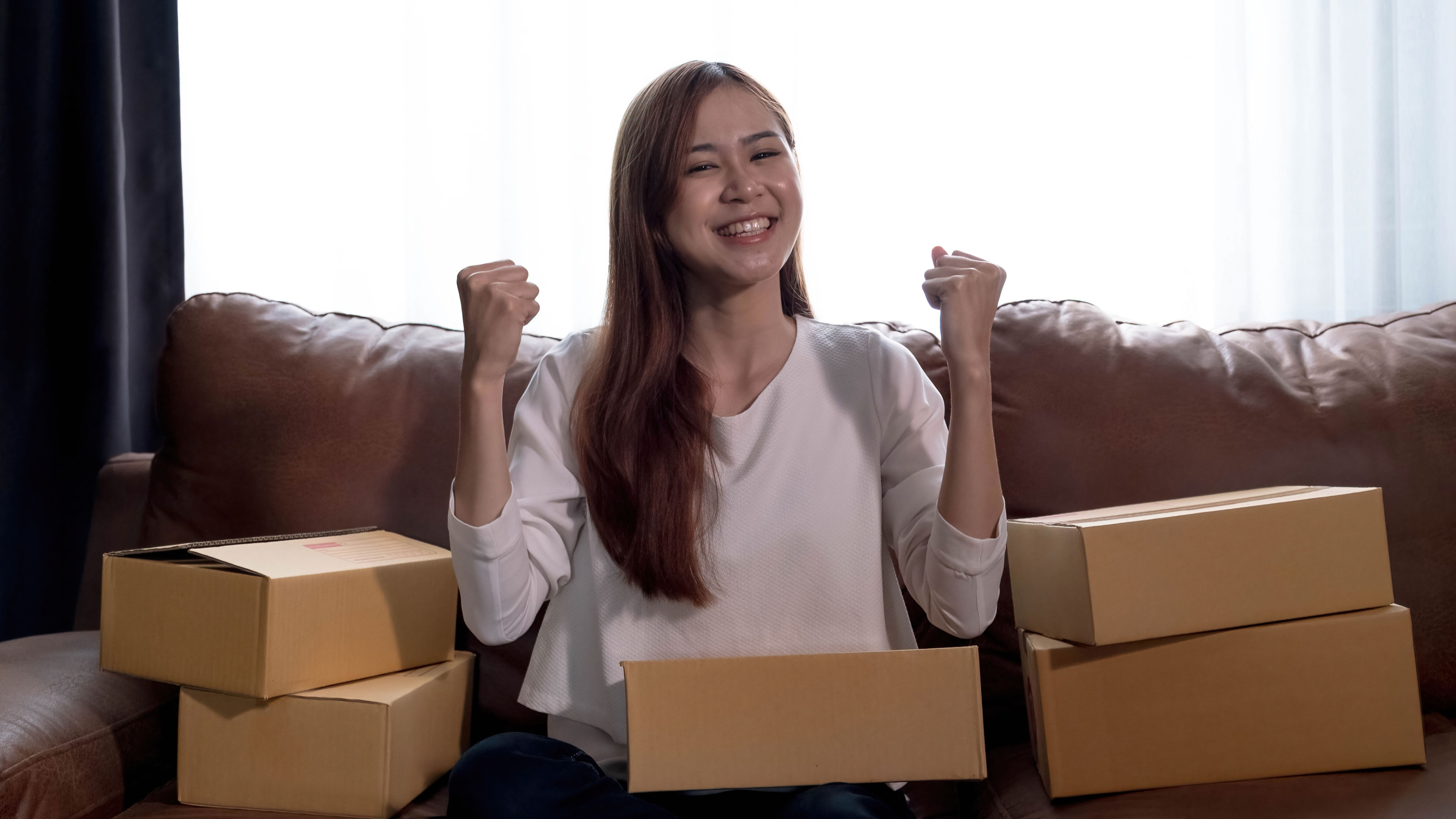 A Happy woman with some parcels around