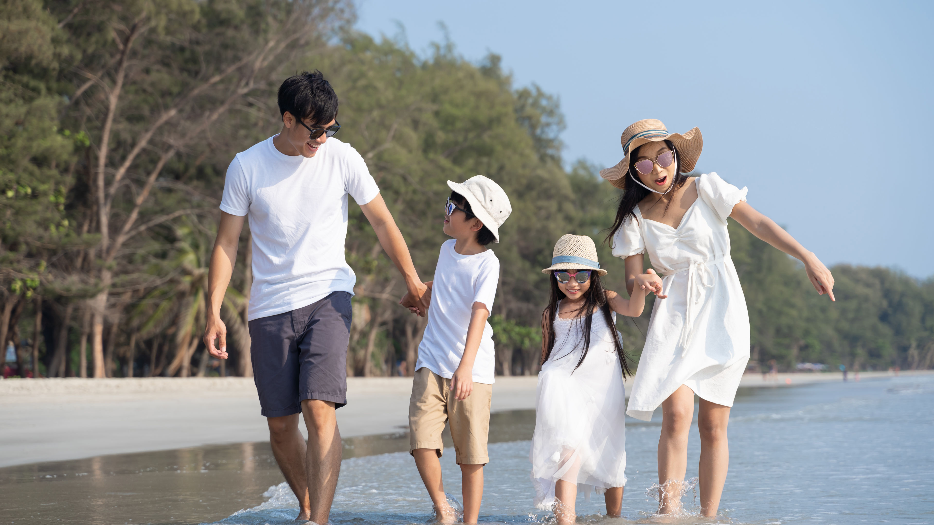 Asian family at beach 