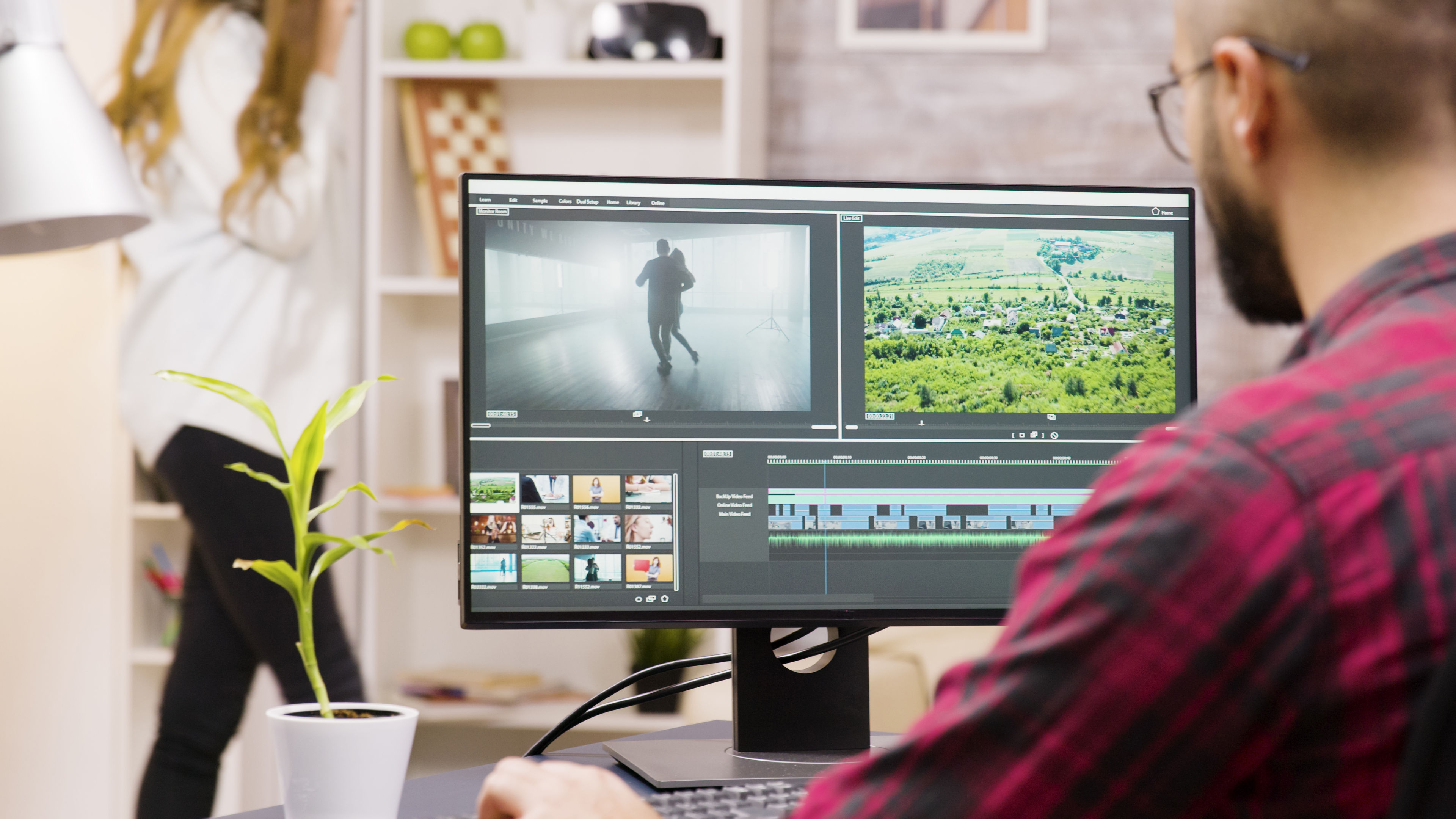 Back view of creative content creator working from home