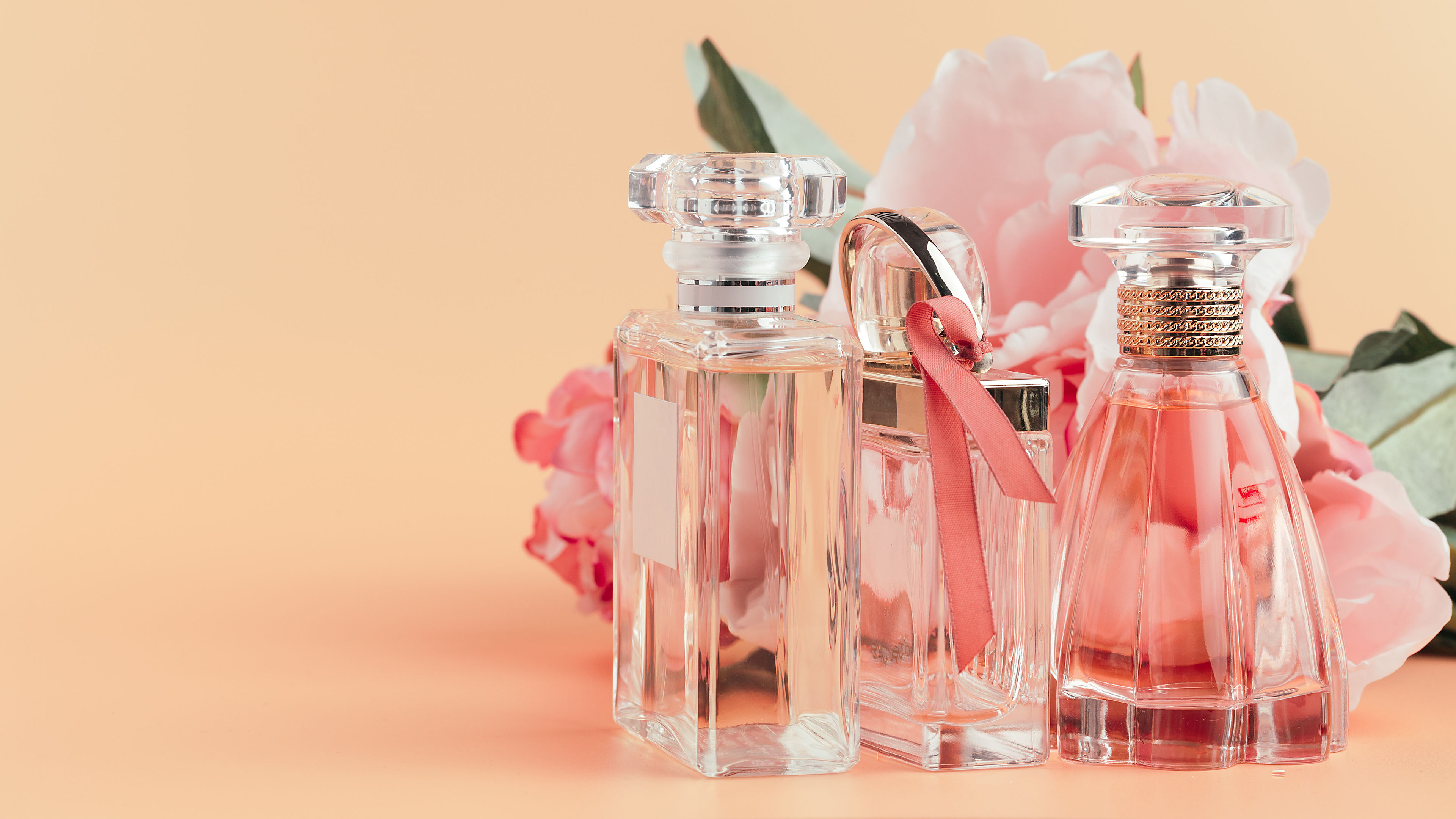 Bottle of perfume with flowers. 