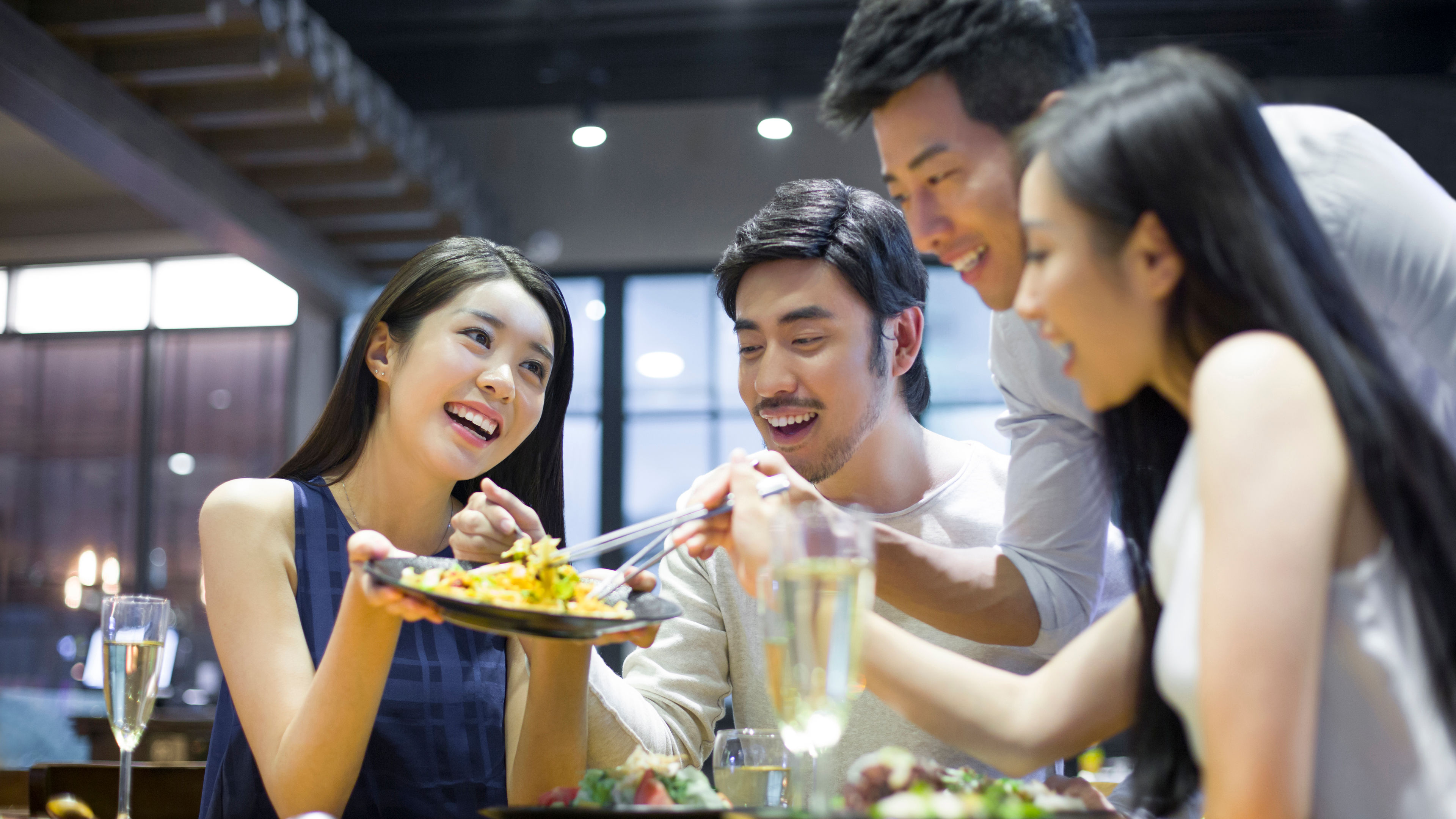 Group of Asian friends with happy face sharing food