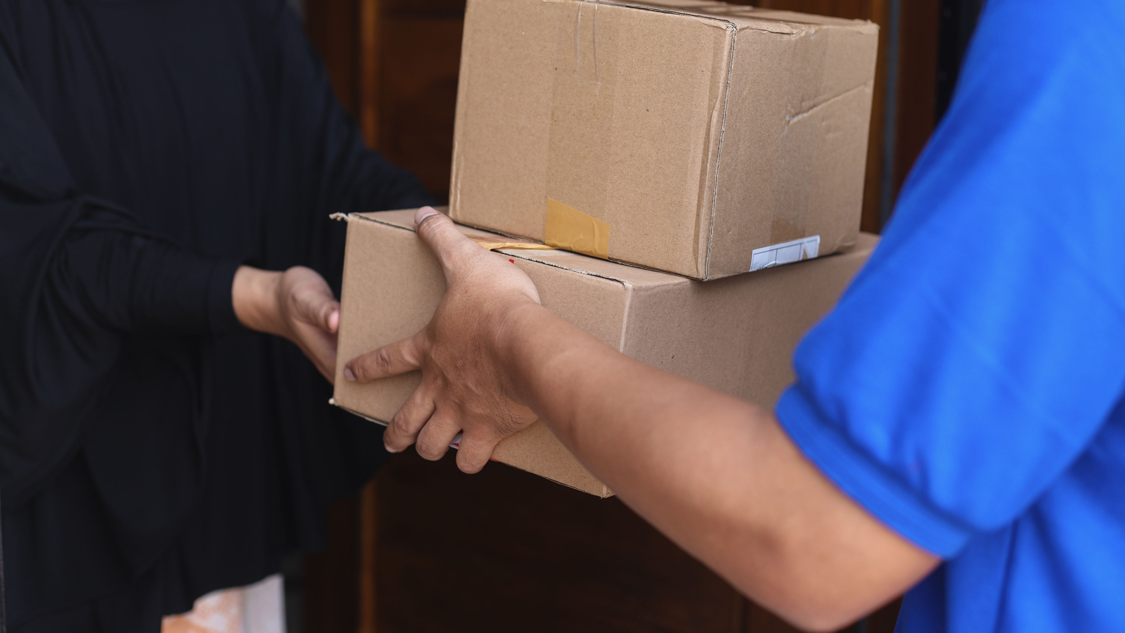 Two cartons are delivering to a person 