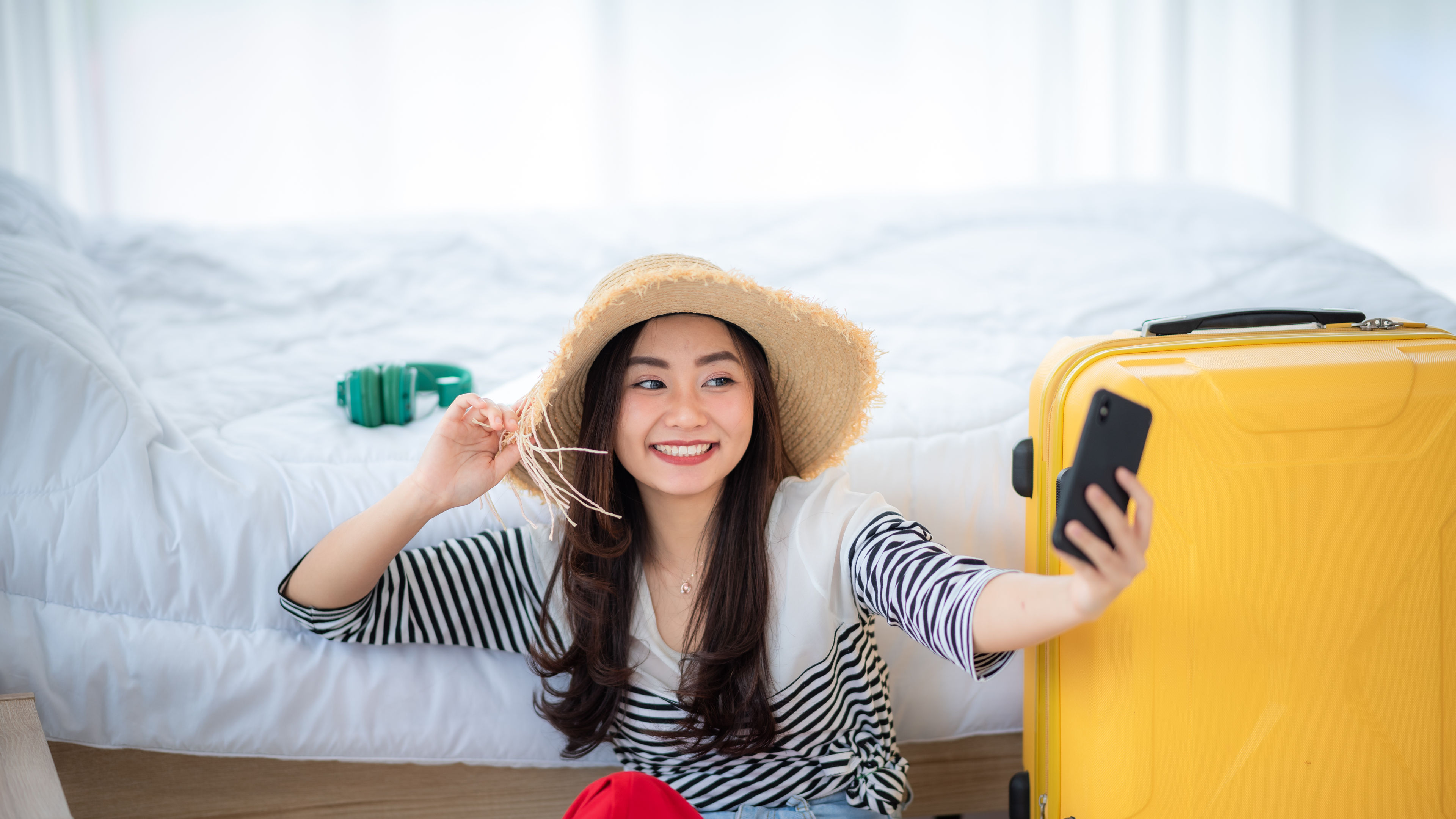 Young asian women with hat taking selfie