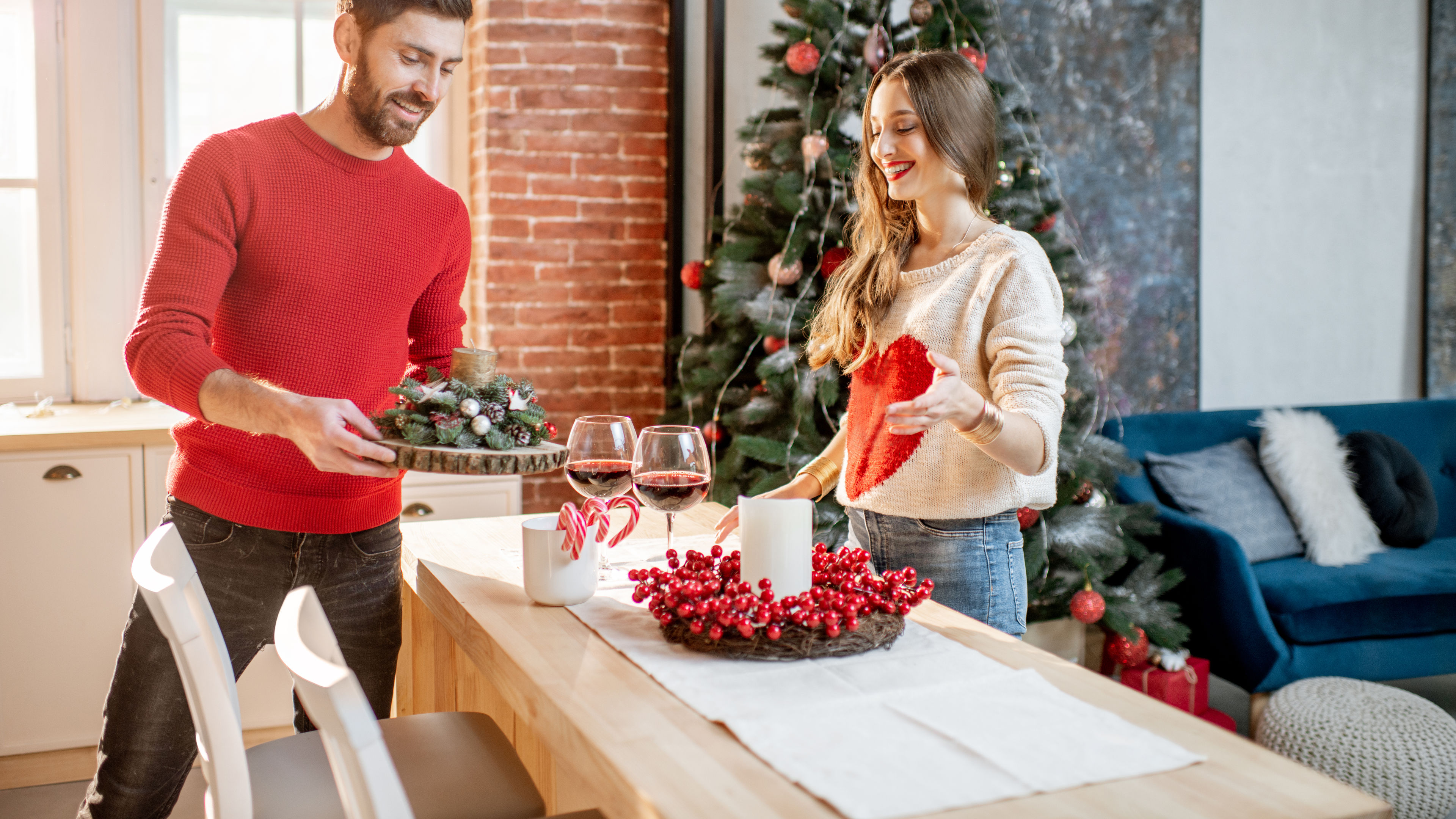 A couple getting ready to celebrate the New Year indoors. 
