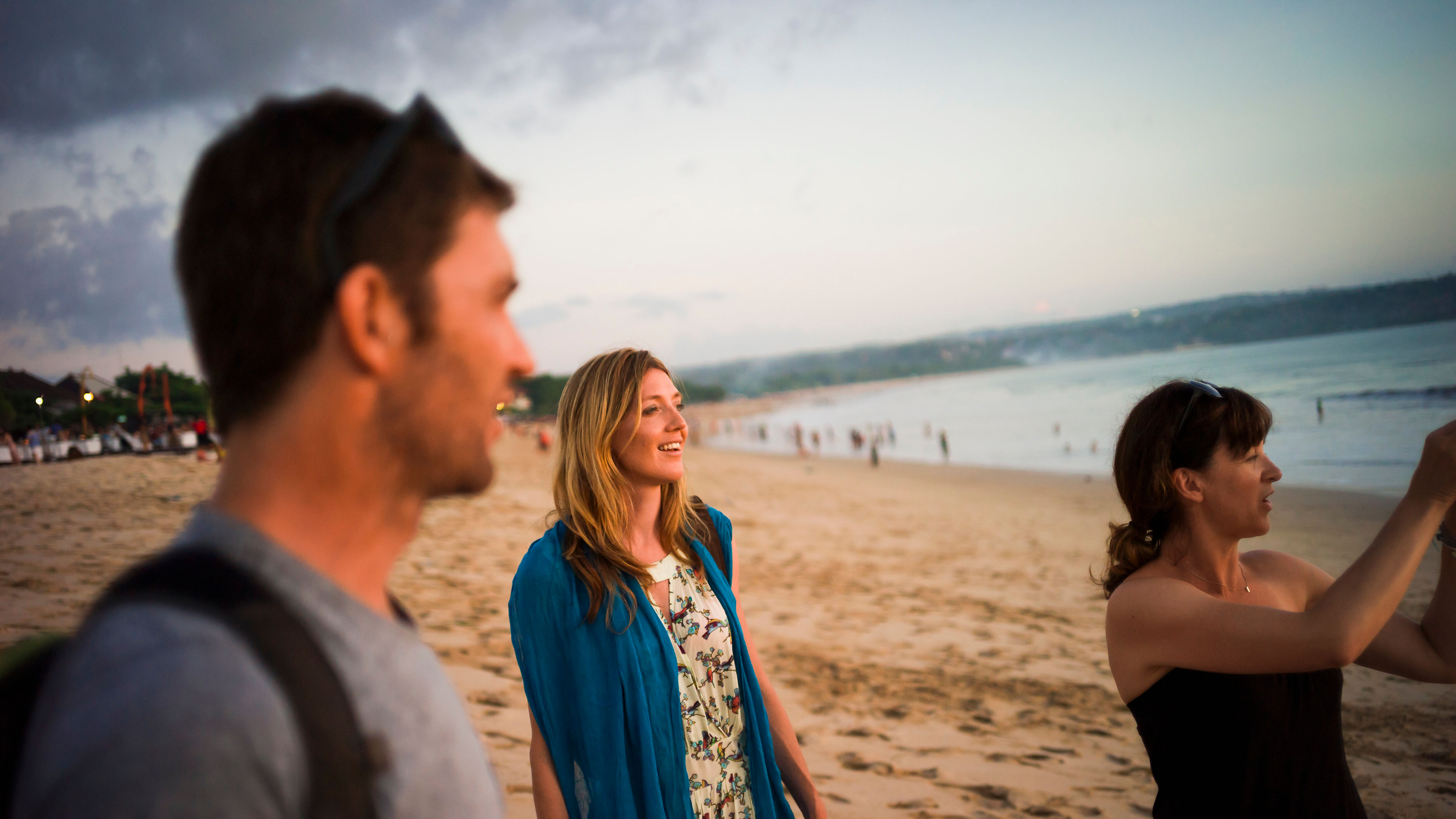 Group of friends walking on beach, Australia 