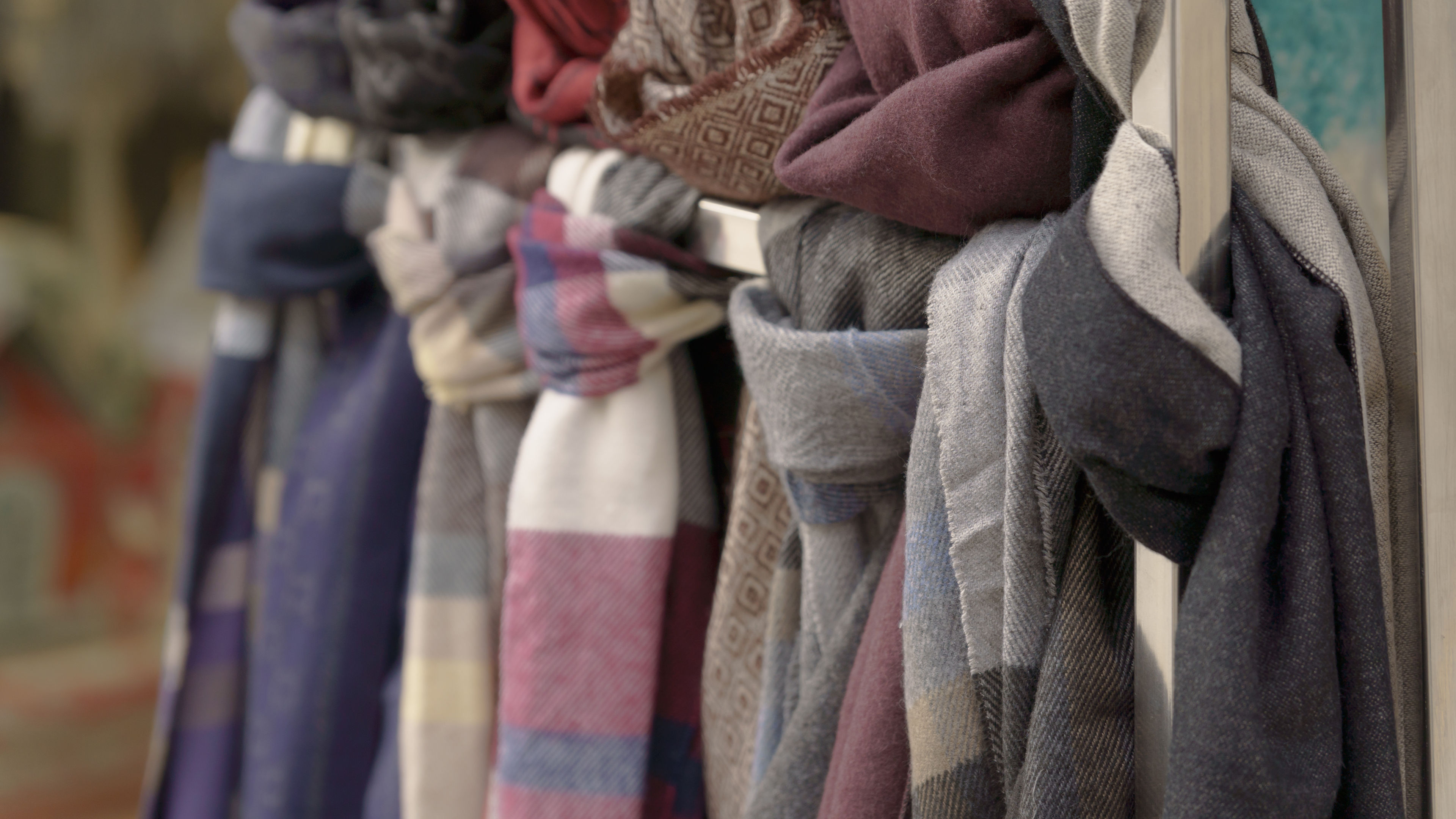 scarves folded on a display stand