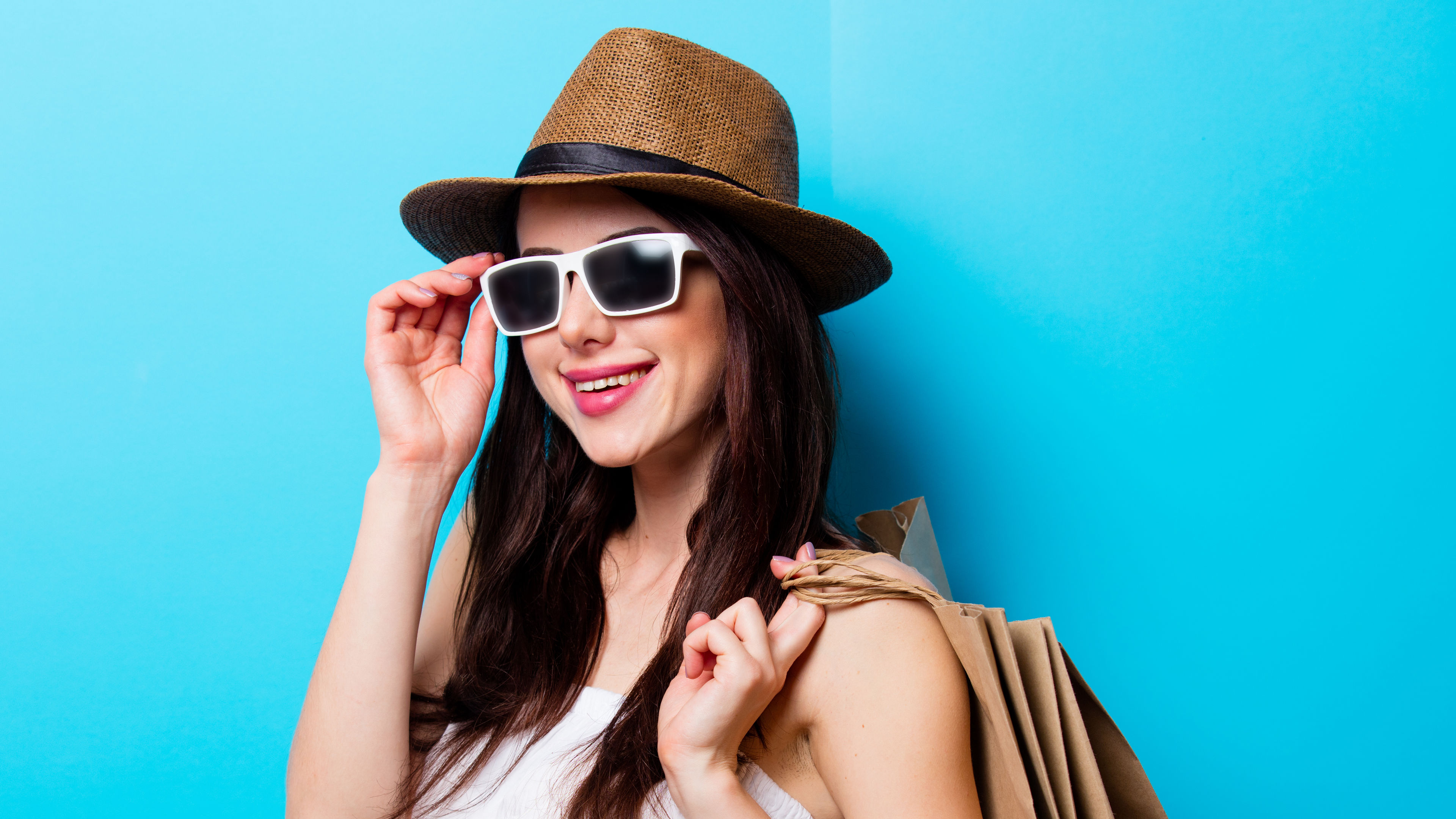 Portrait of a young woman with shopping bags. 
