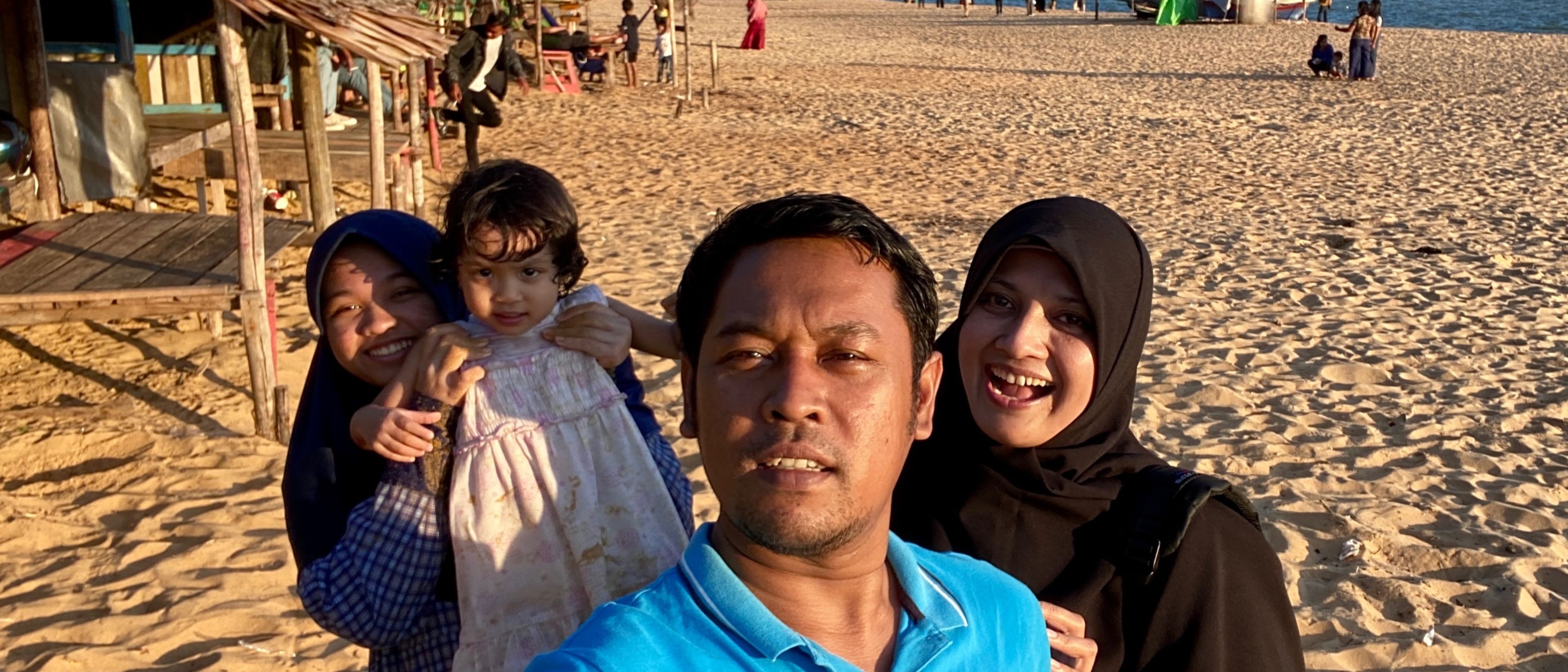 Family on a sandy beach side