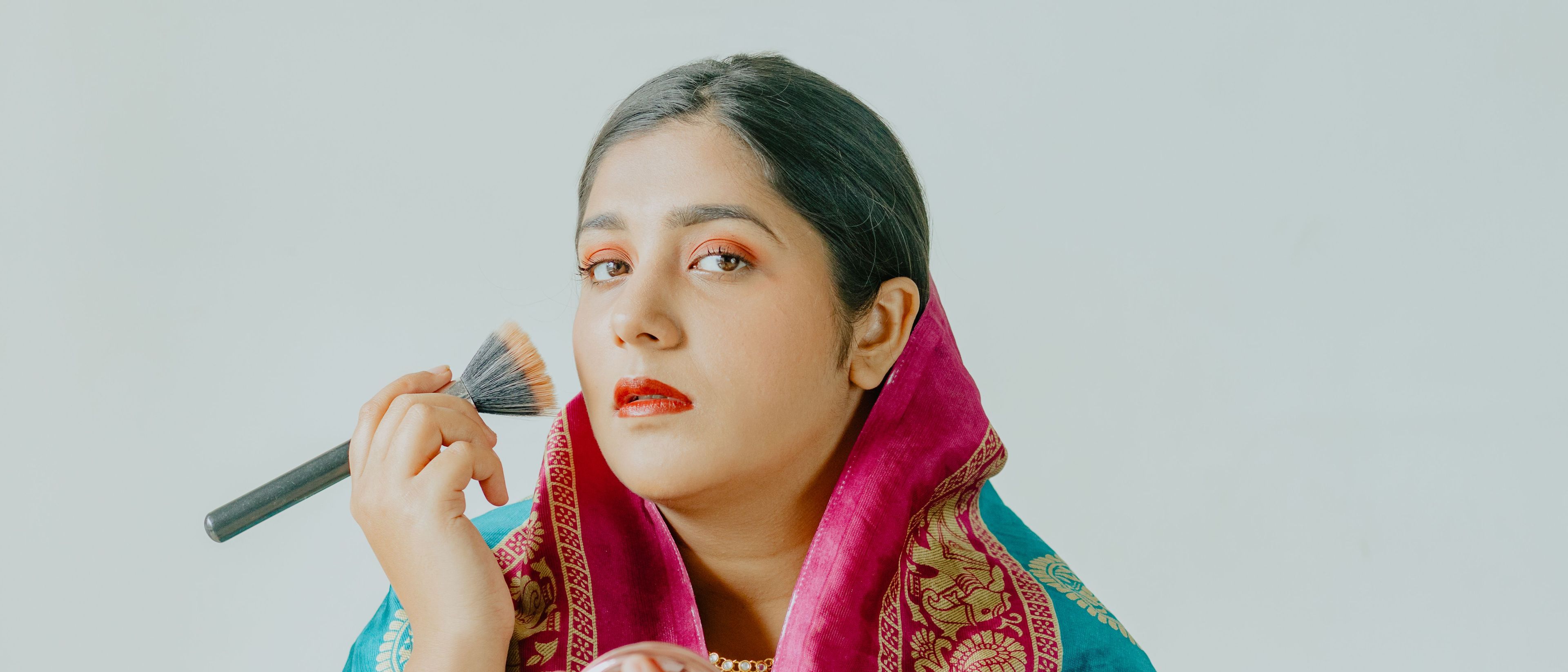 Woman with makeup brush