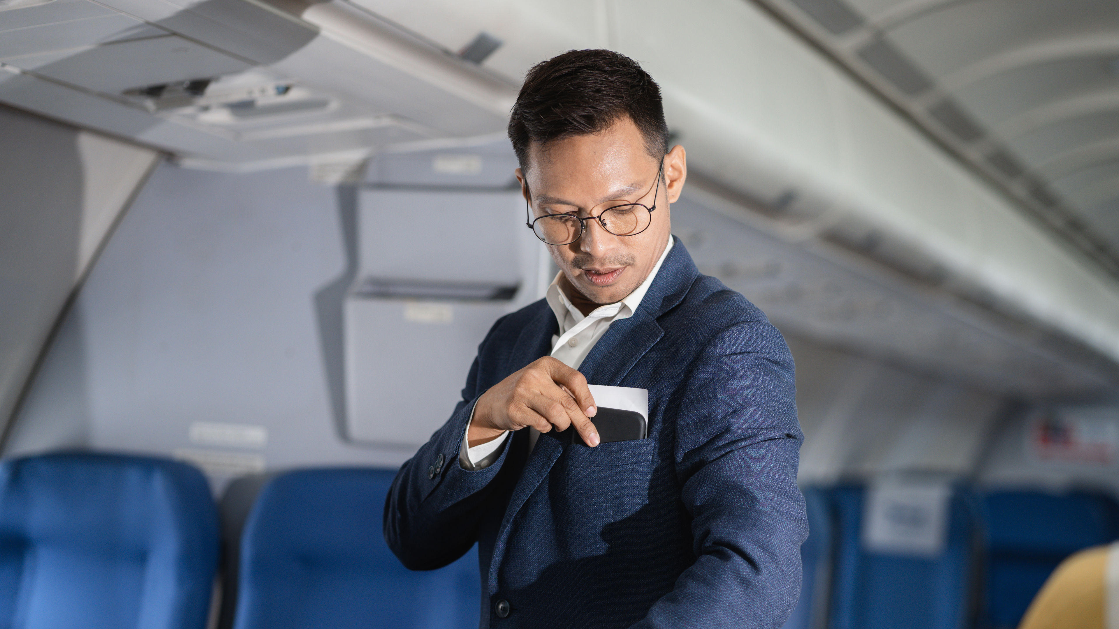 Airplane, travel and portrait of male with journey and backpack. 