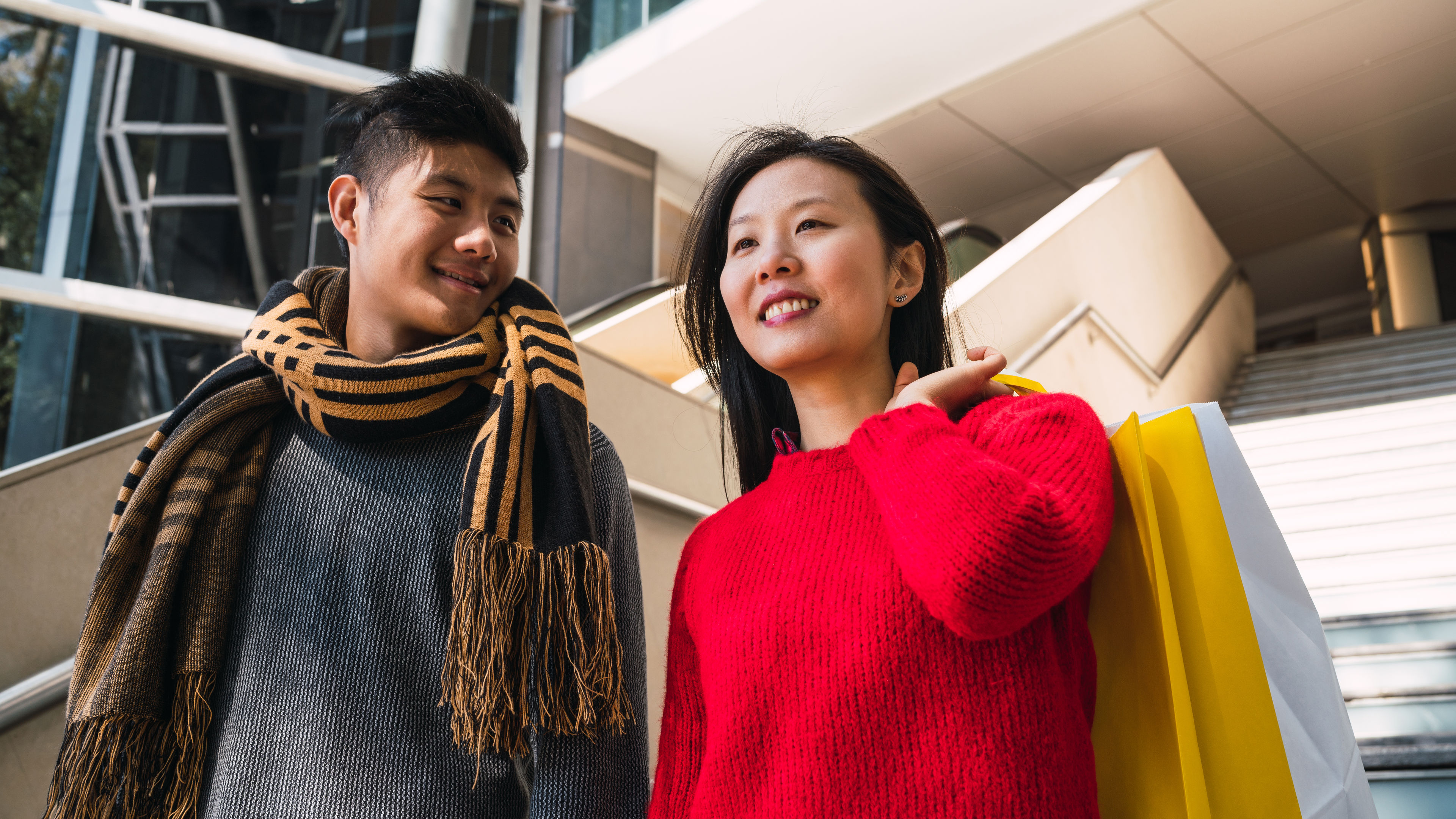 Asian couple shopping in the mall. 

 