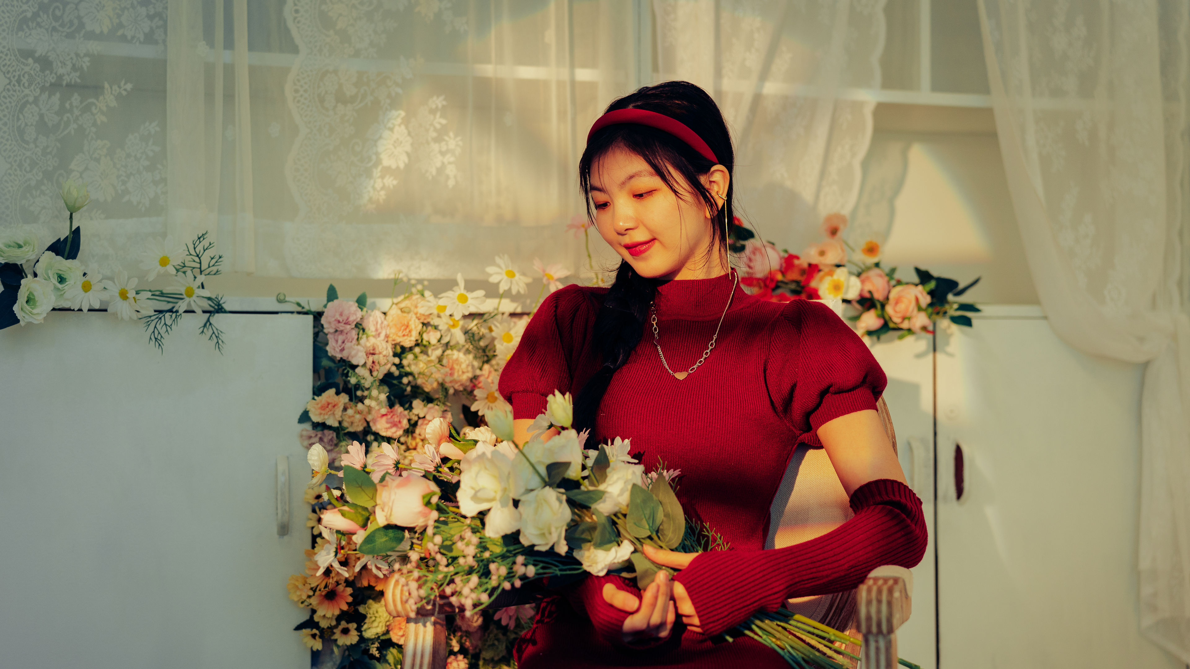 asian girl in red dress sitting 