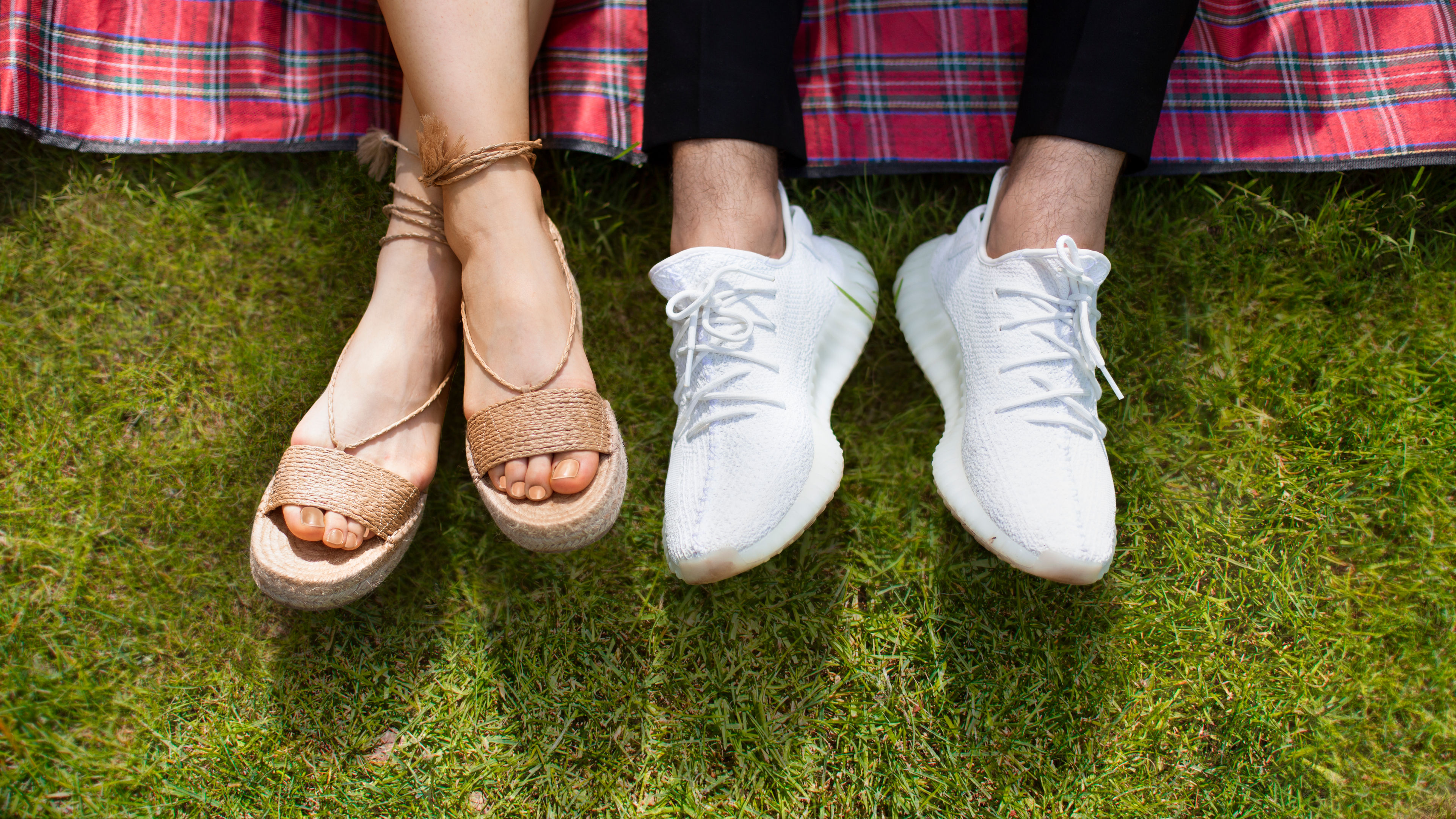 A man and a woman with shoes on their legs 