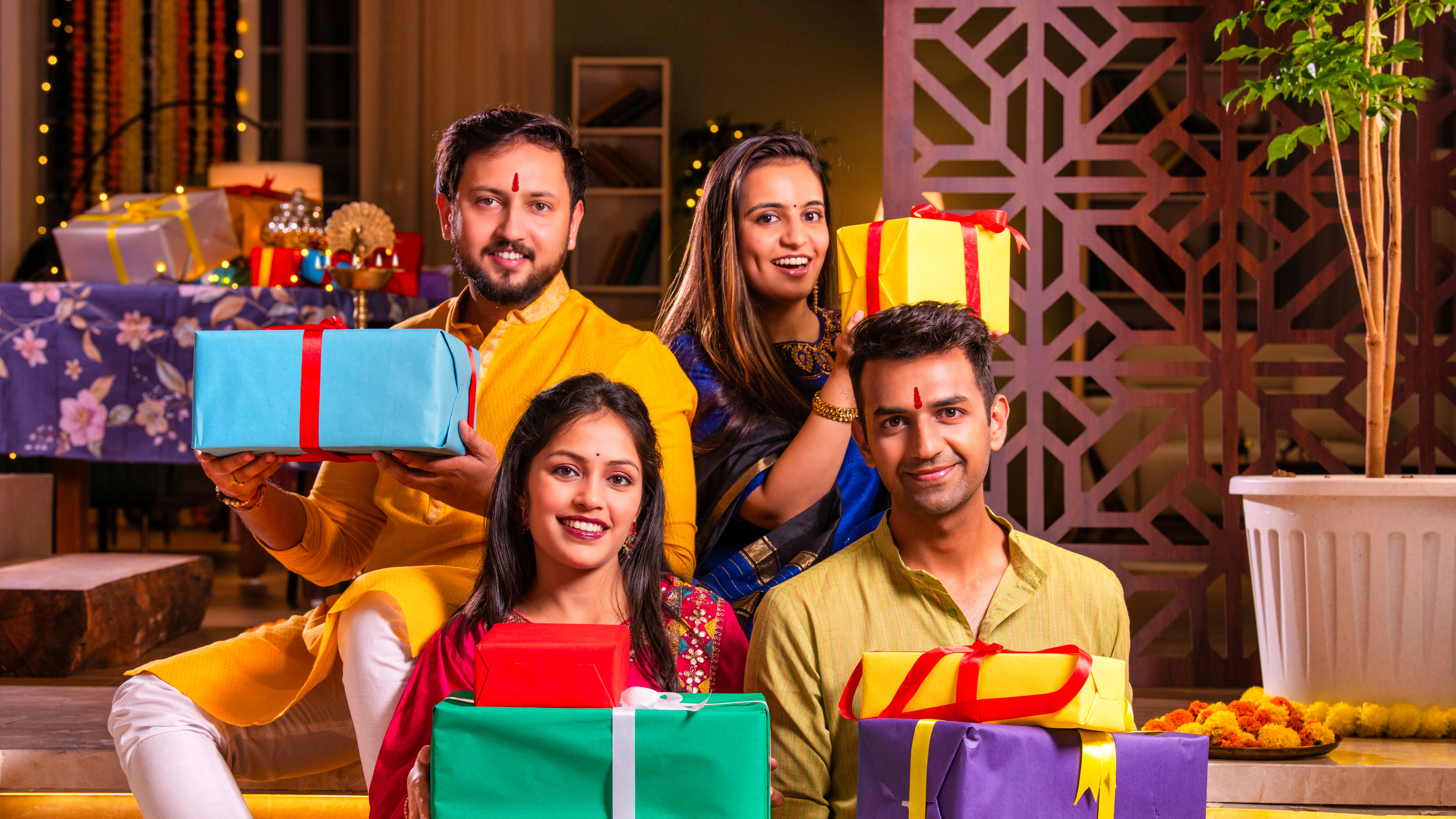 A big family with Diwali gifts in hand 
