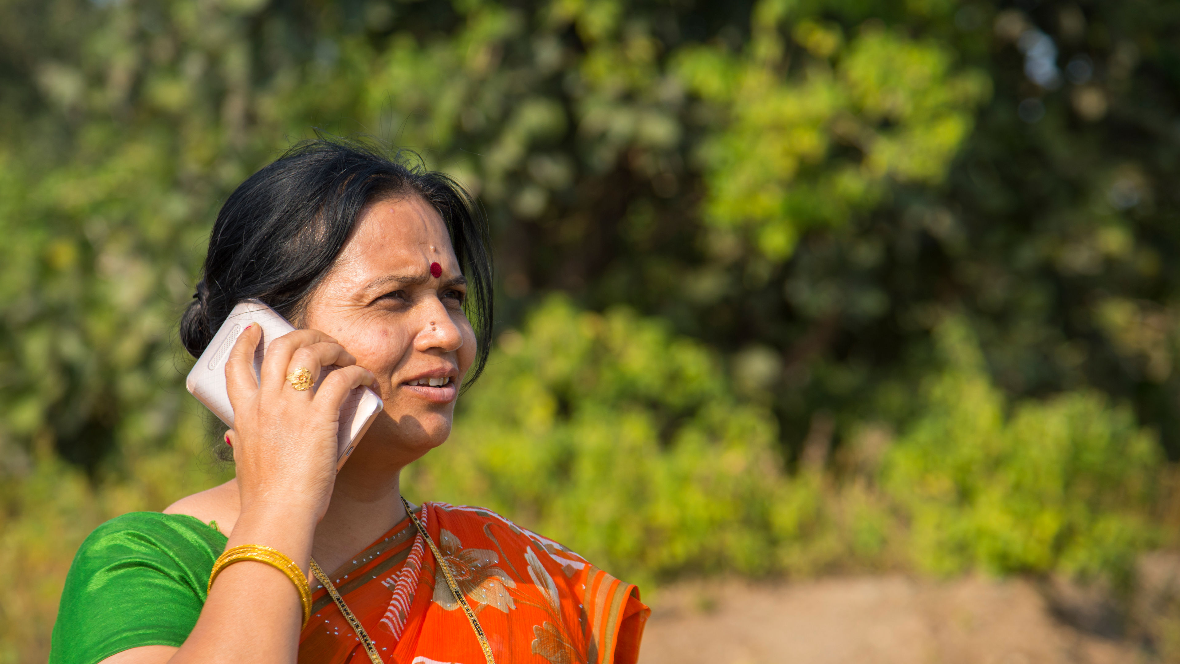 Indian woman using smartphone at outdoor 