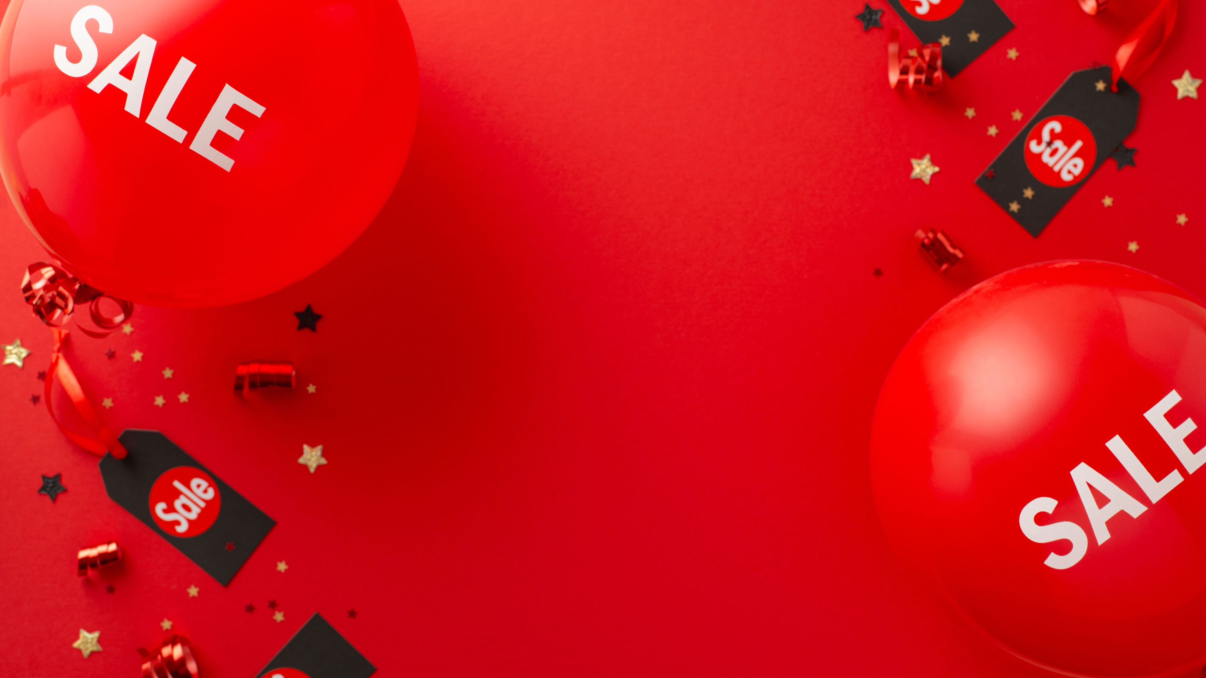 Get ready for Black Friday sales! Top-down view of "sale" balloons, price tags 