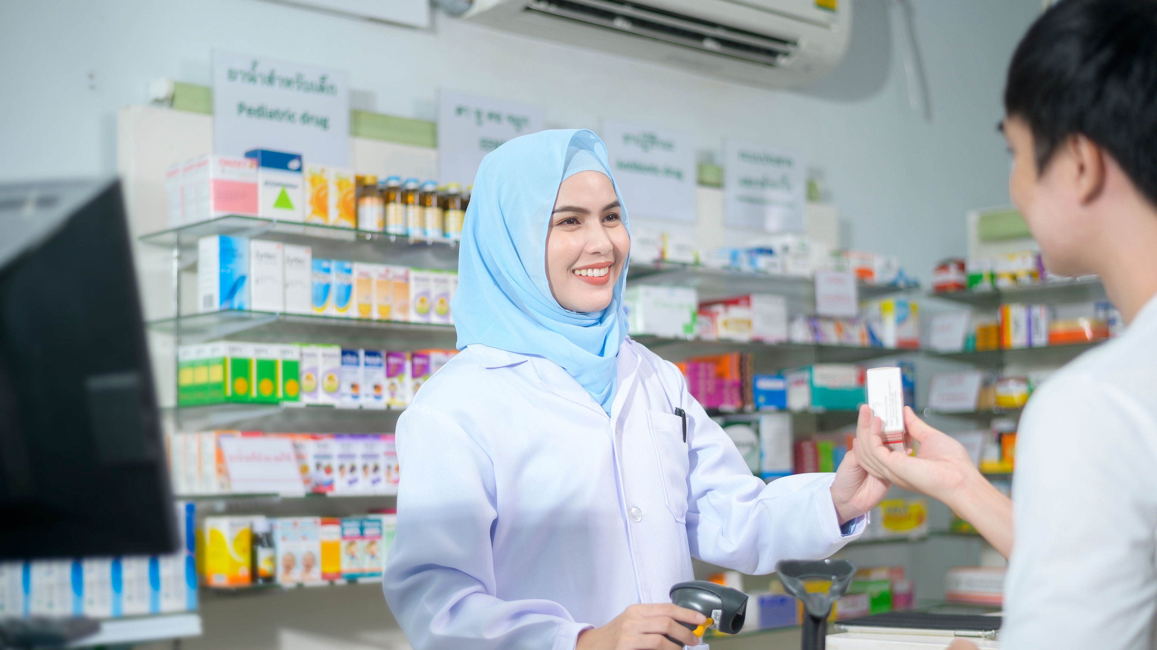 Malaysian Woman Buying Medicines Pictures, 