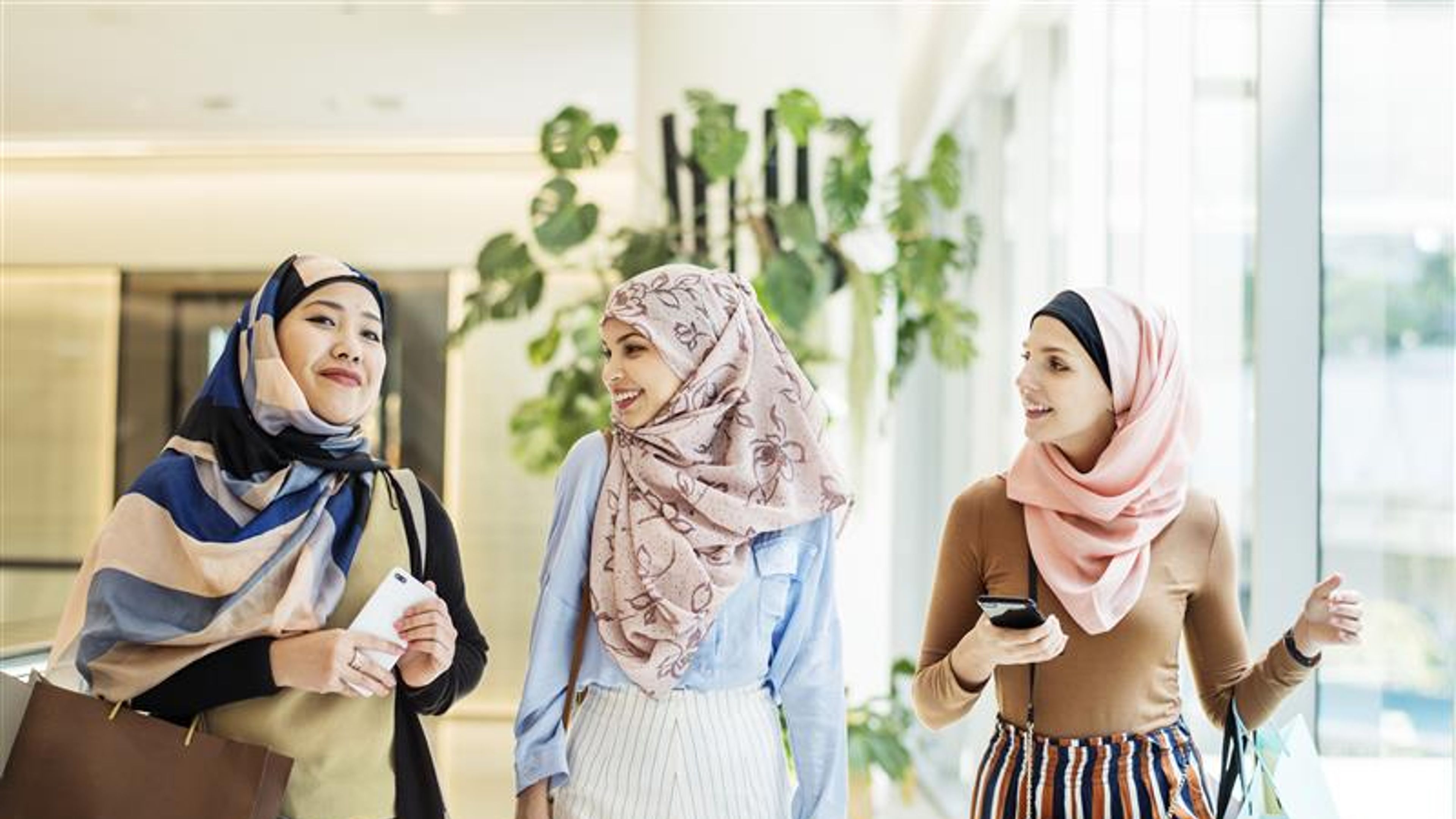 Three friends shopping together