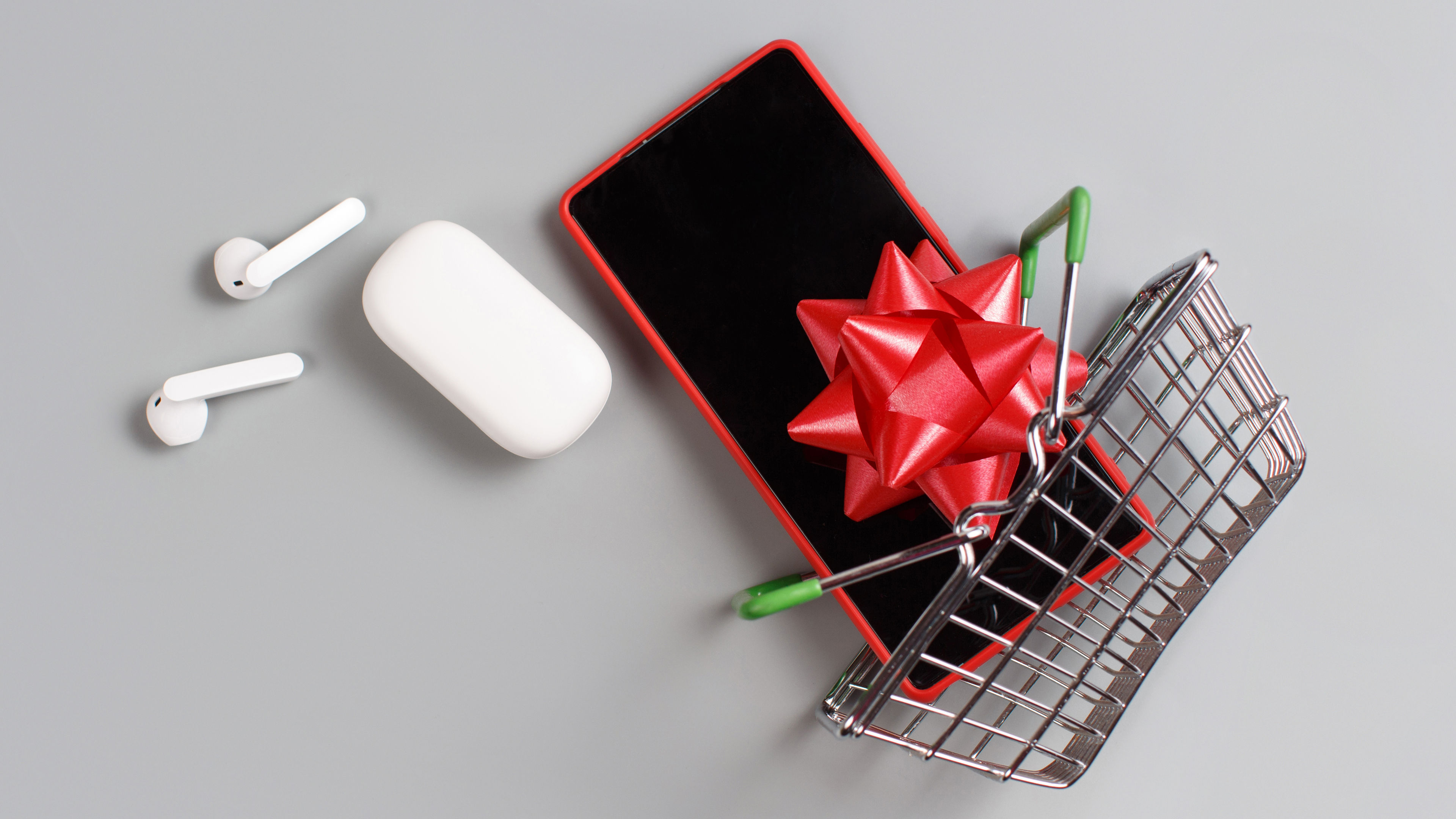 A small shopping cart with some gadgets 