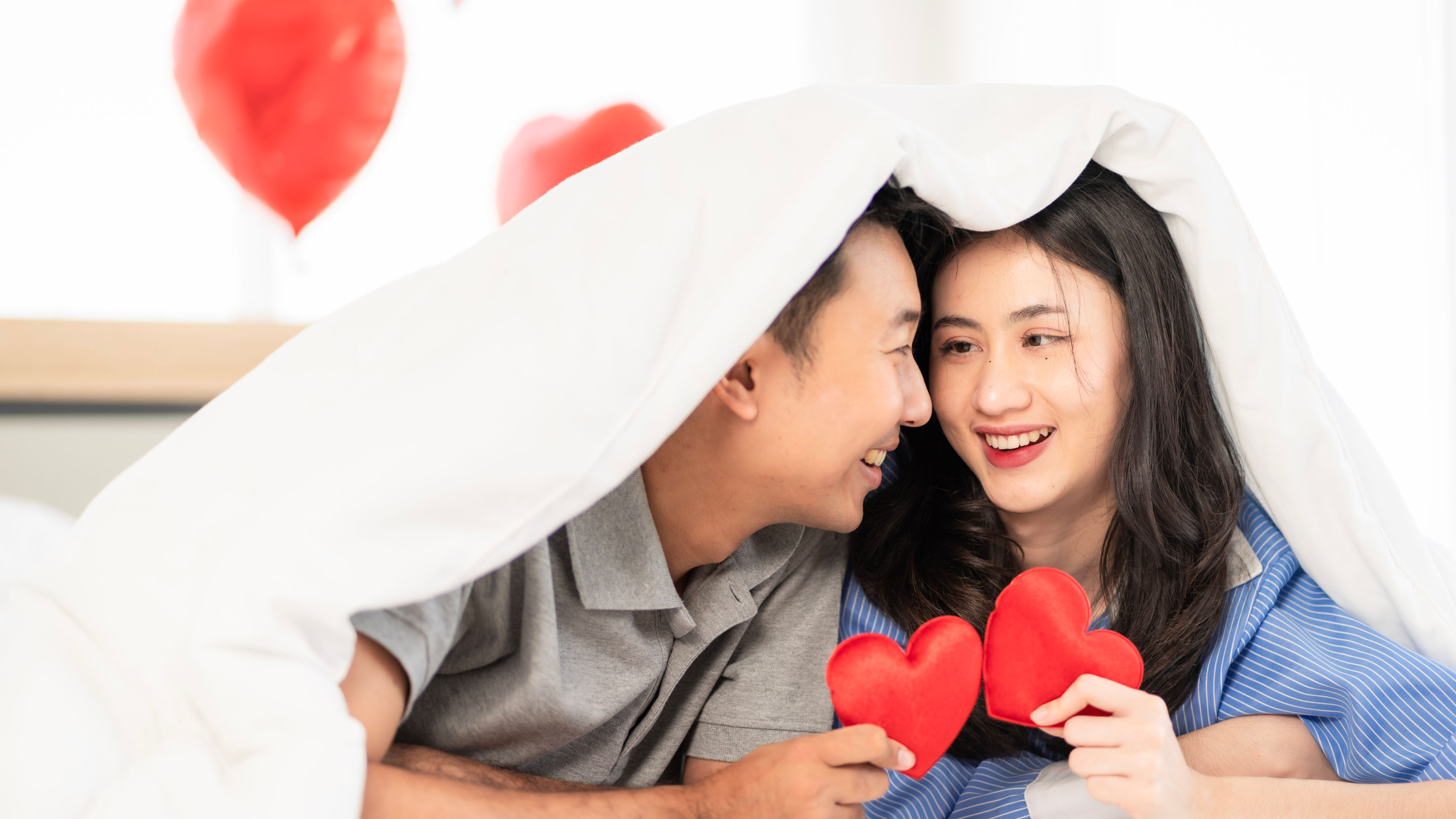 Asian couple Showing love surprise giving flowers 