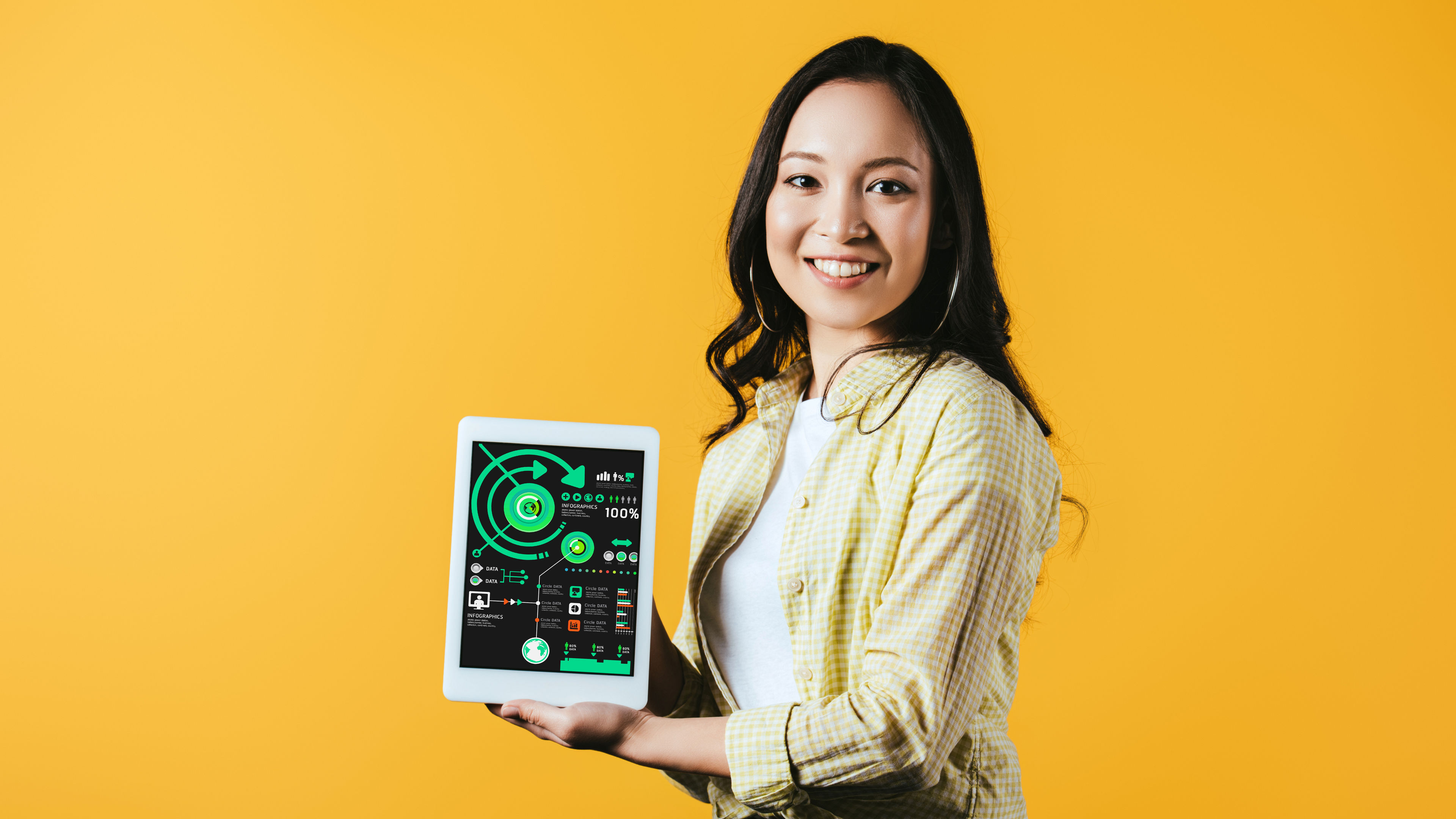 Asian girl with digital tablet in yellow background 