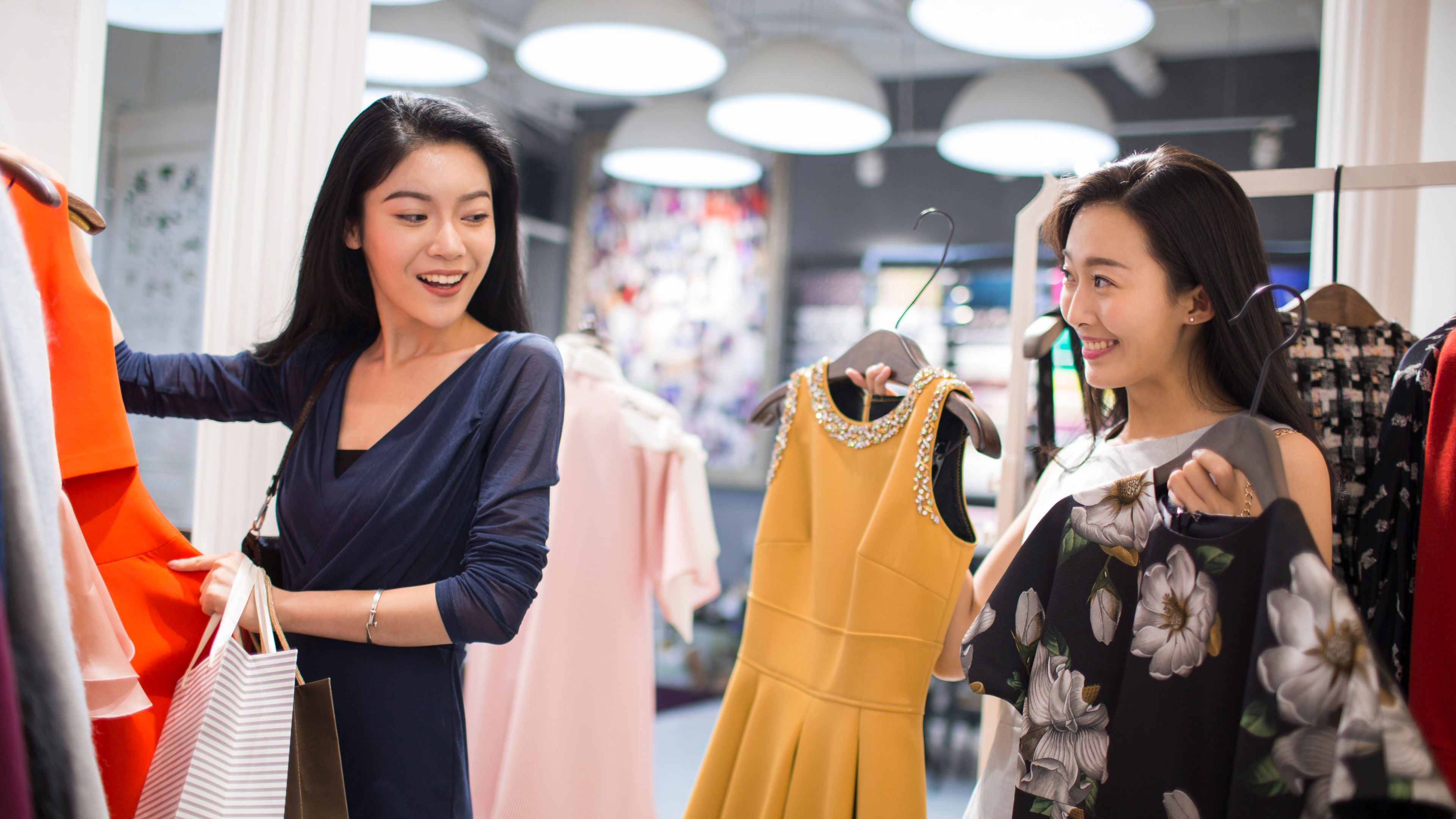 Two female best friends shopping in a mall