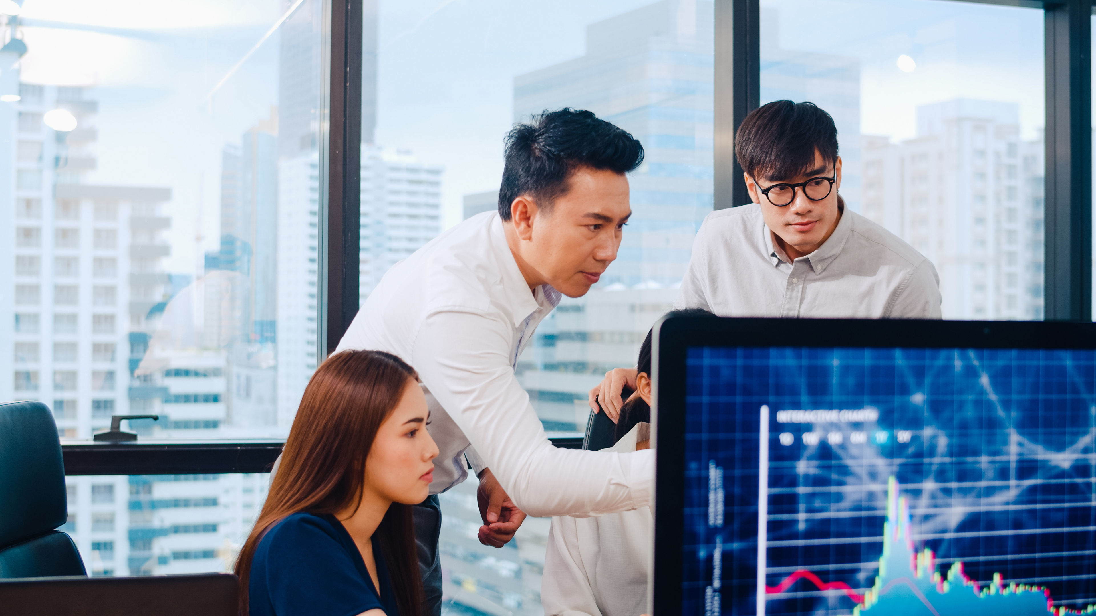 Businesspeople using computer presentation and communication meeting in modern office. 