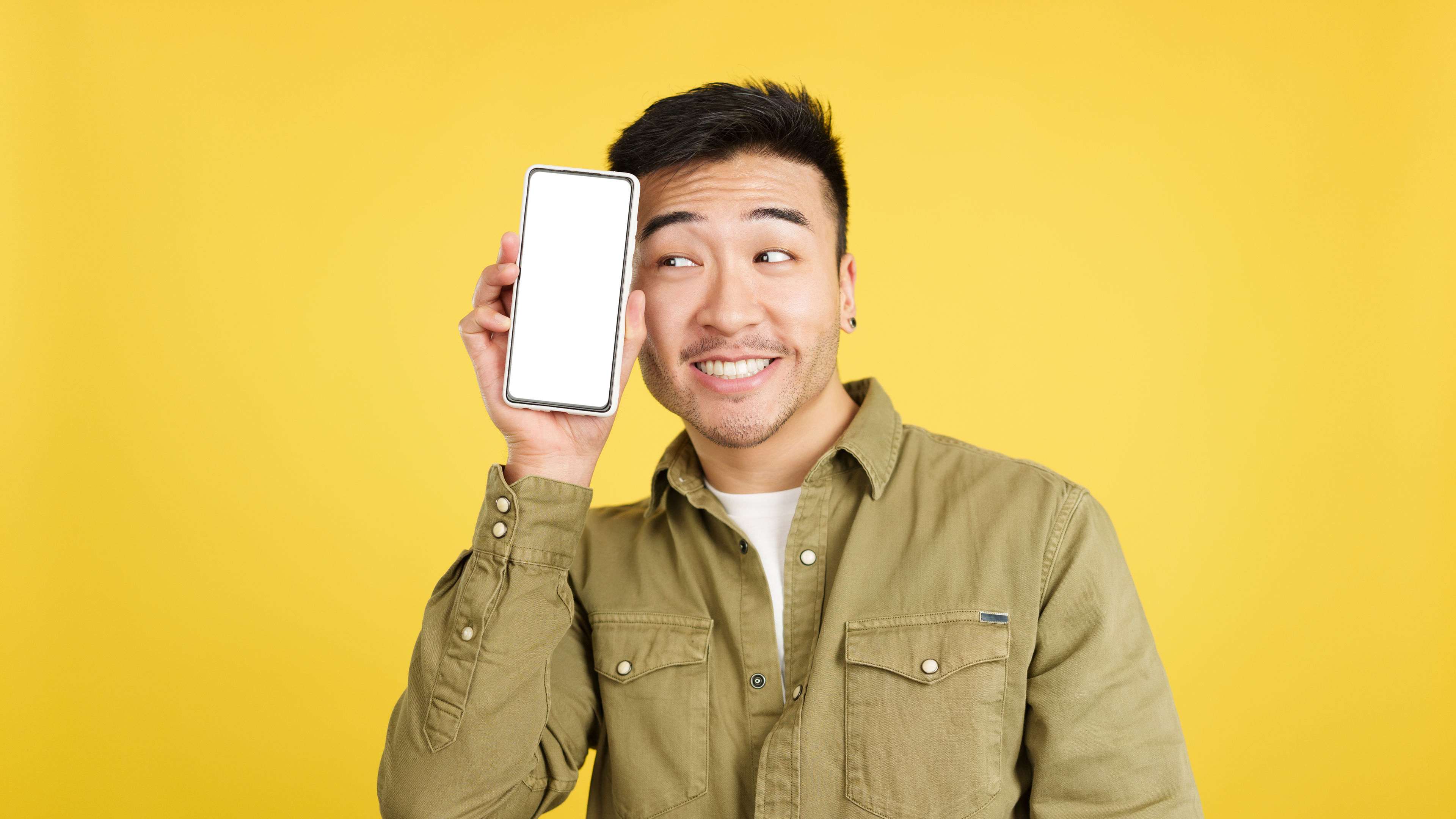 Cool chinese man holding phone 