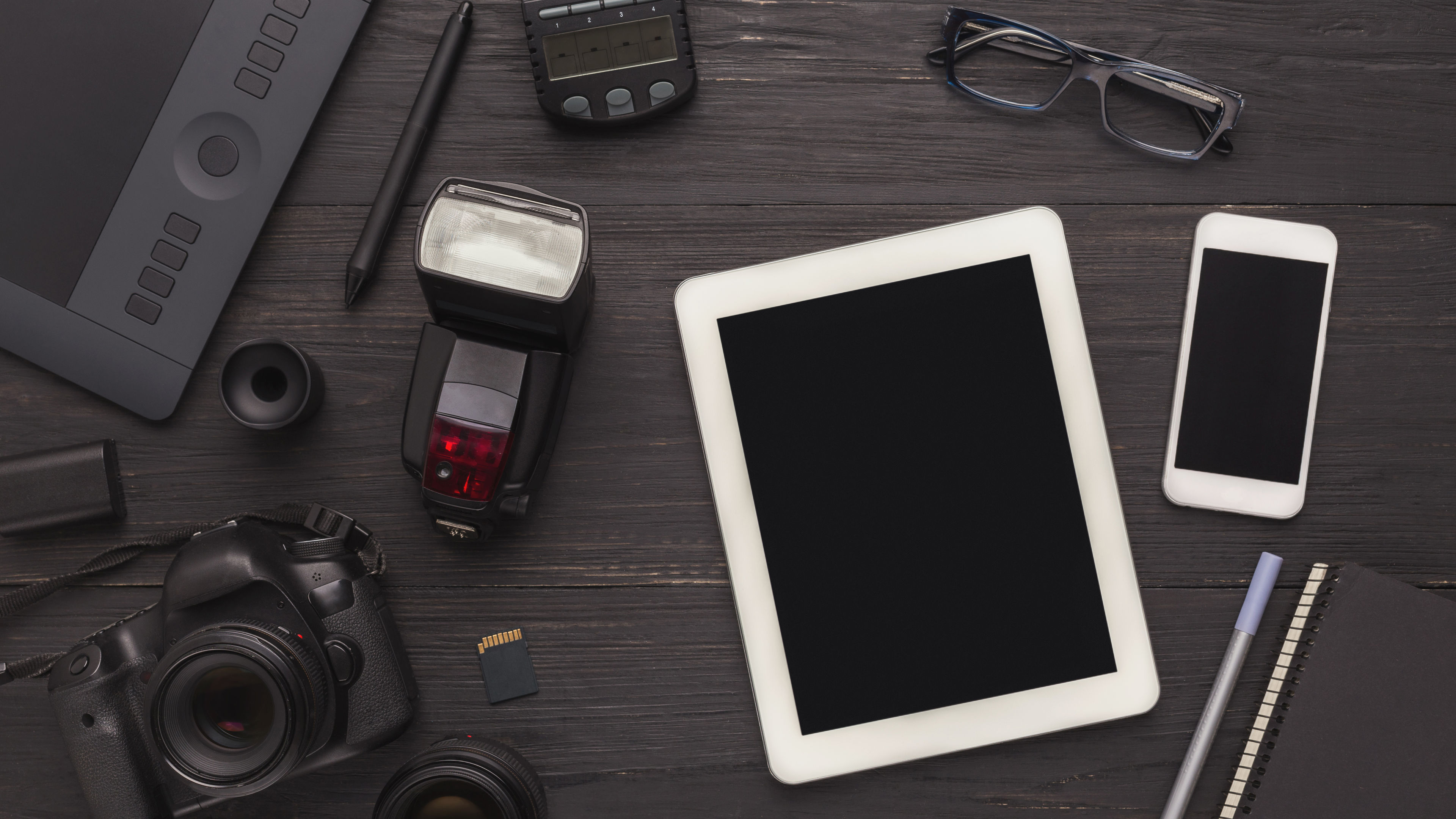 Some gadgets on a wooden table 