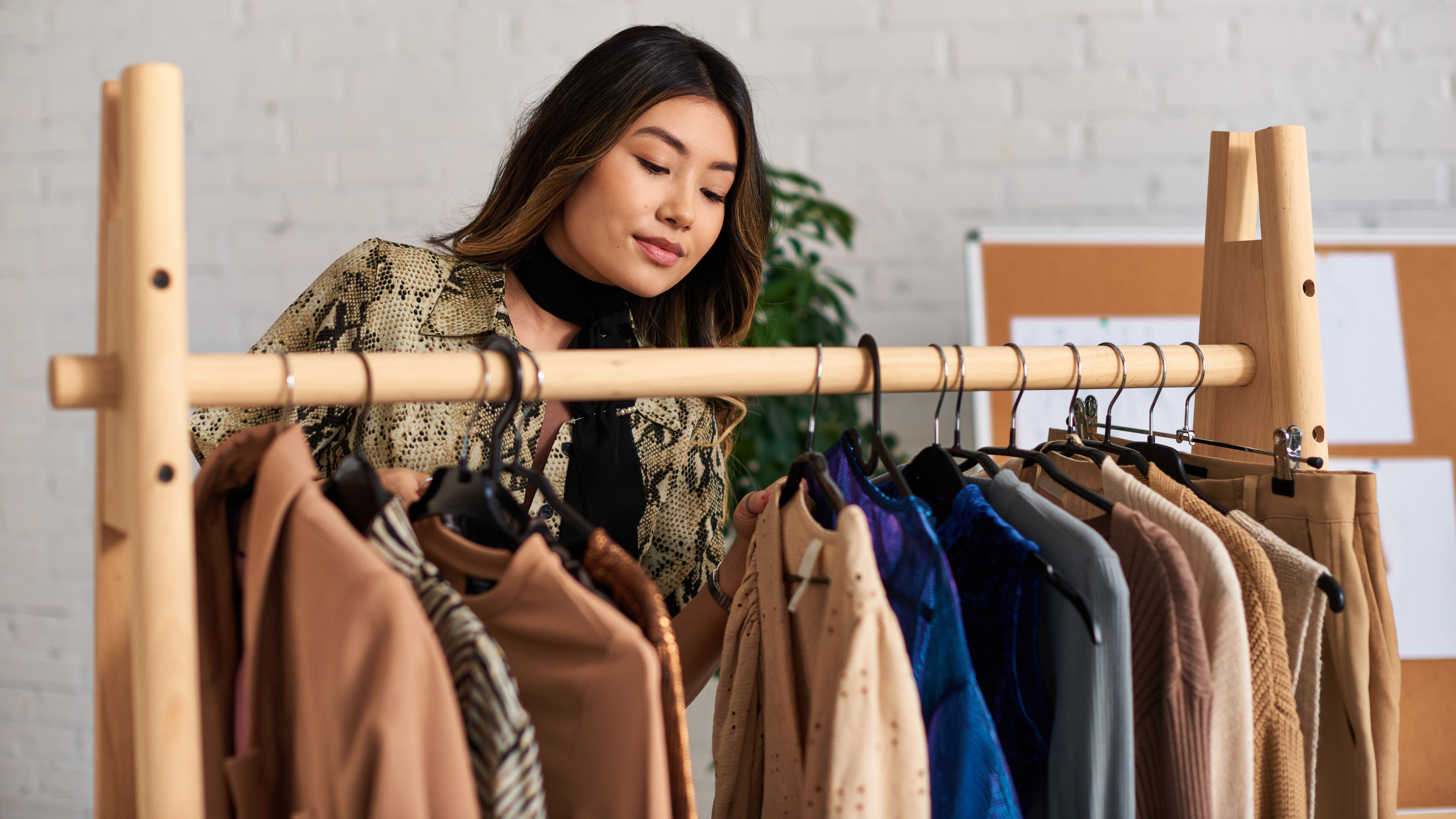 Image of an asian woman lloking at the rack 
