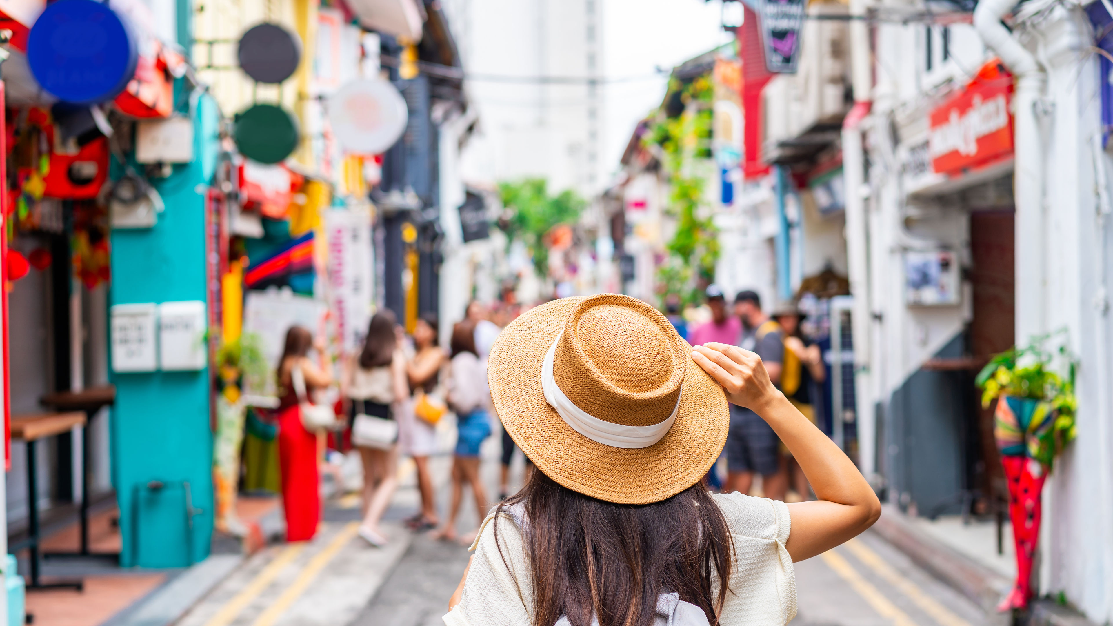 Woman tourist walking with backpack 