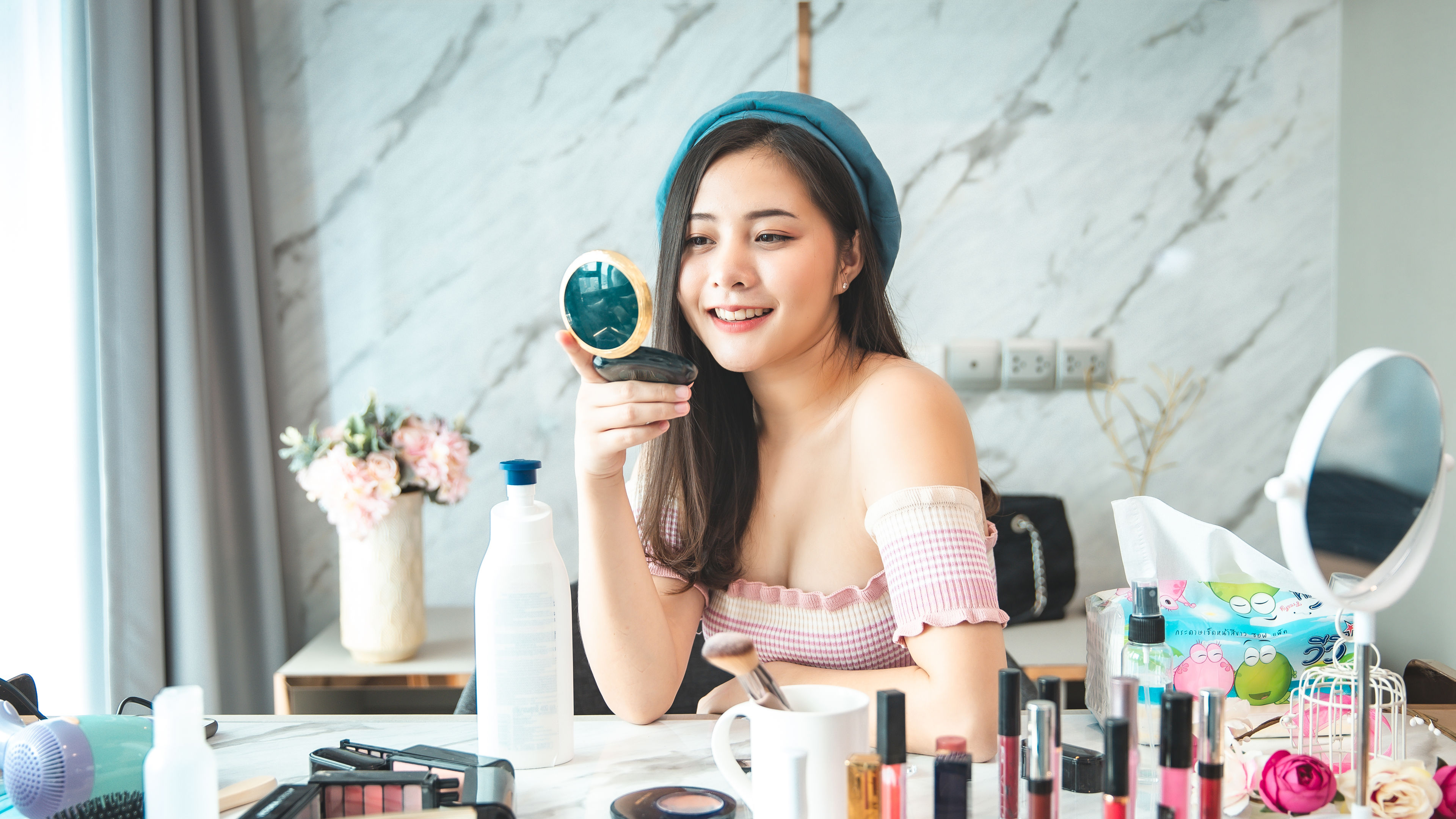 Image of Young asian woman with cosmetics 