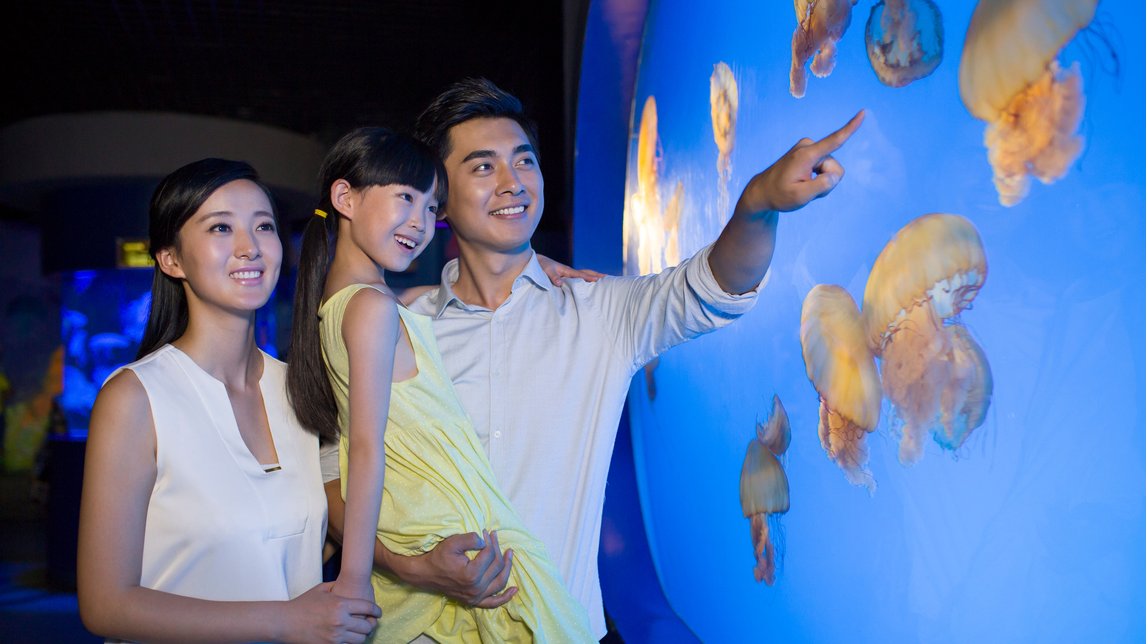 Young family in aquarium