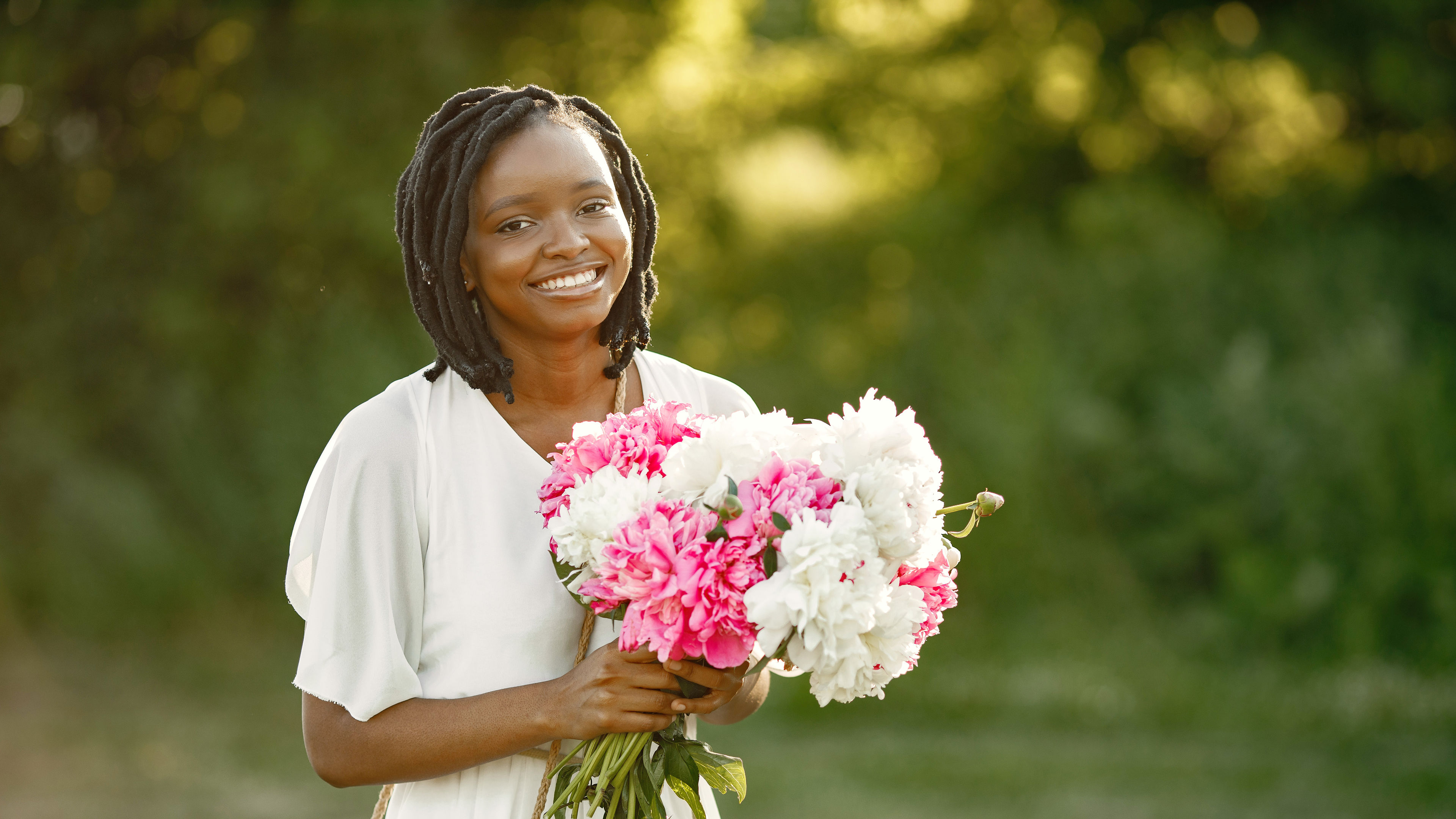 Portrait of beautiful black woman with flowers 