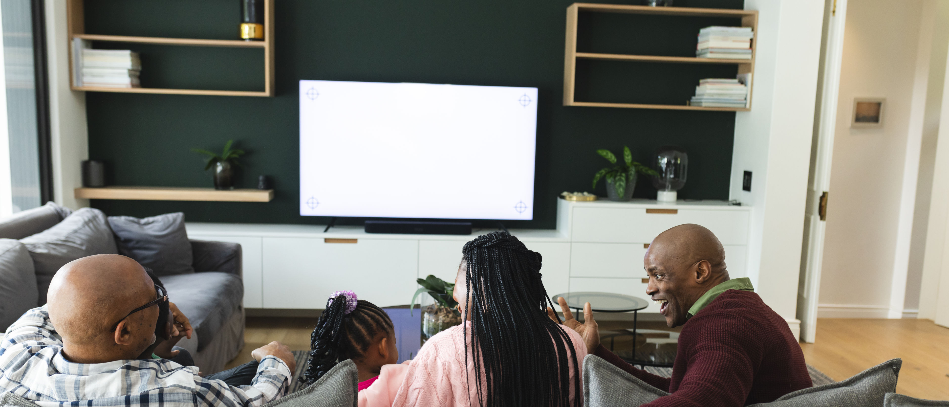 family watching television together