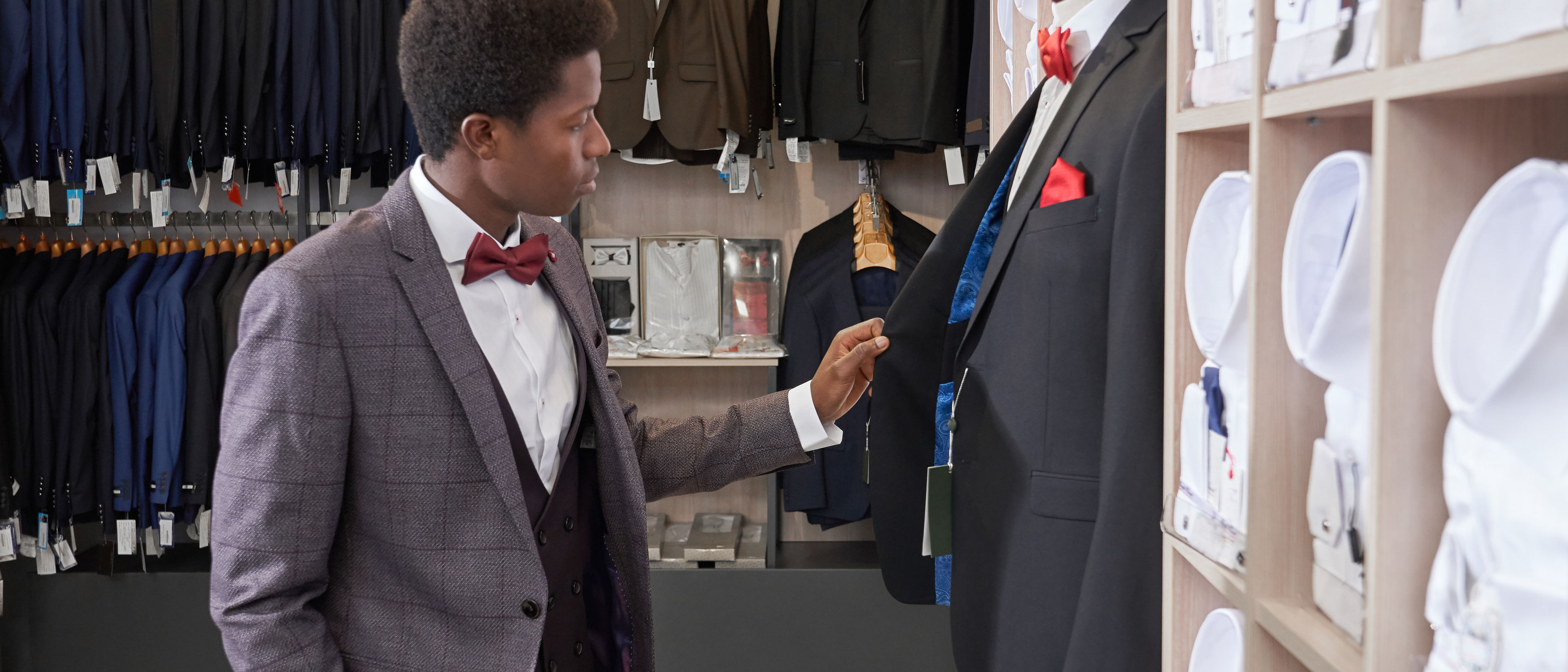 man choosing stylish suit