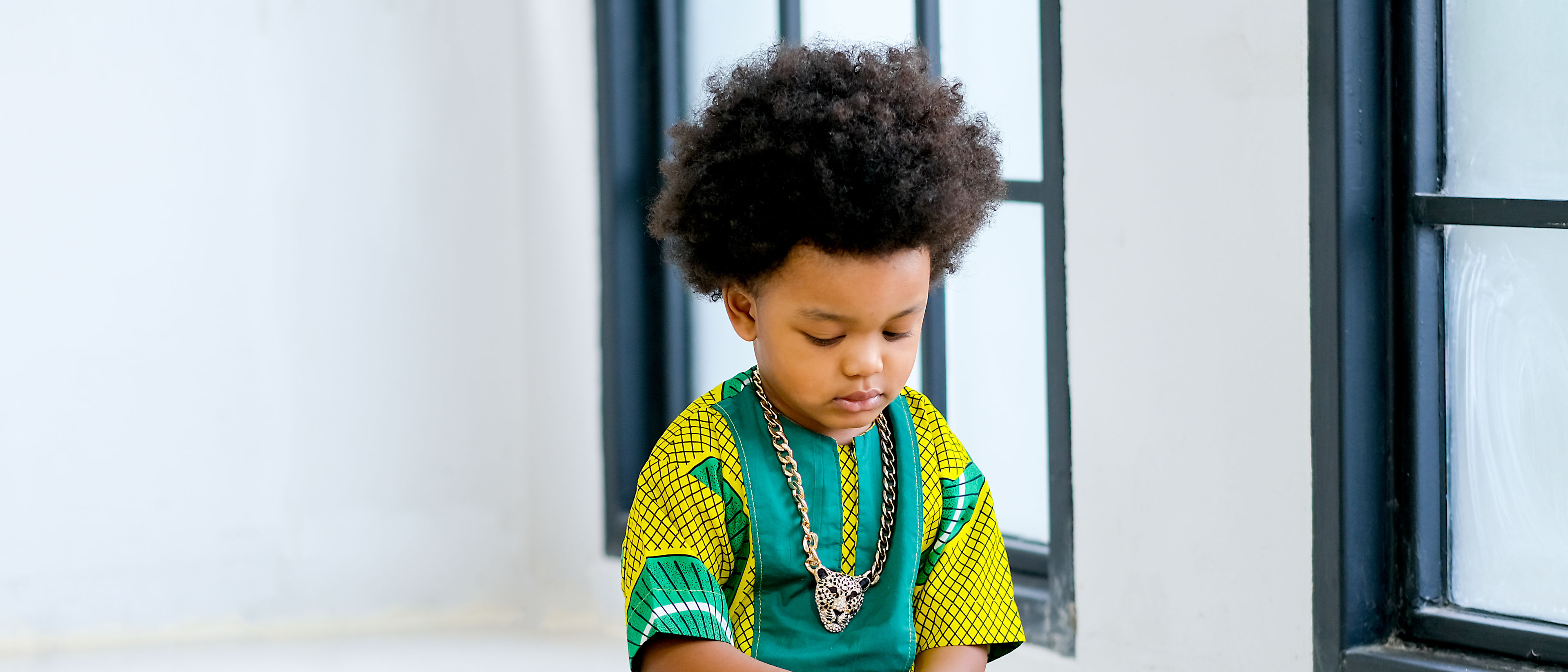 Young boy playing with various toys