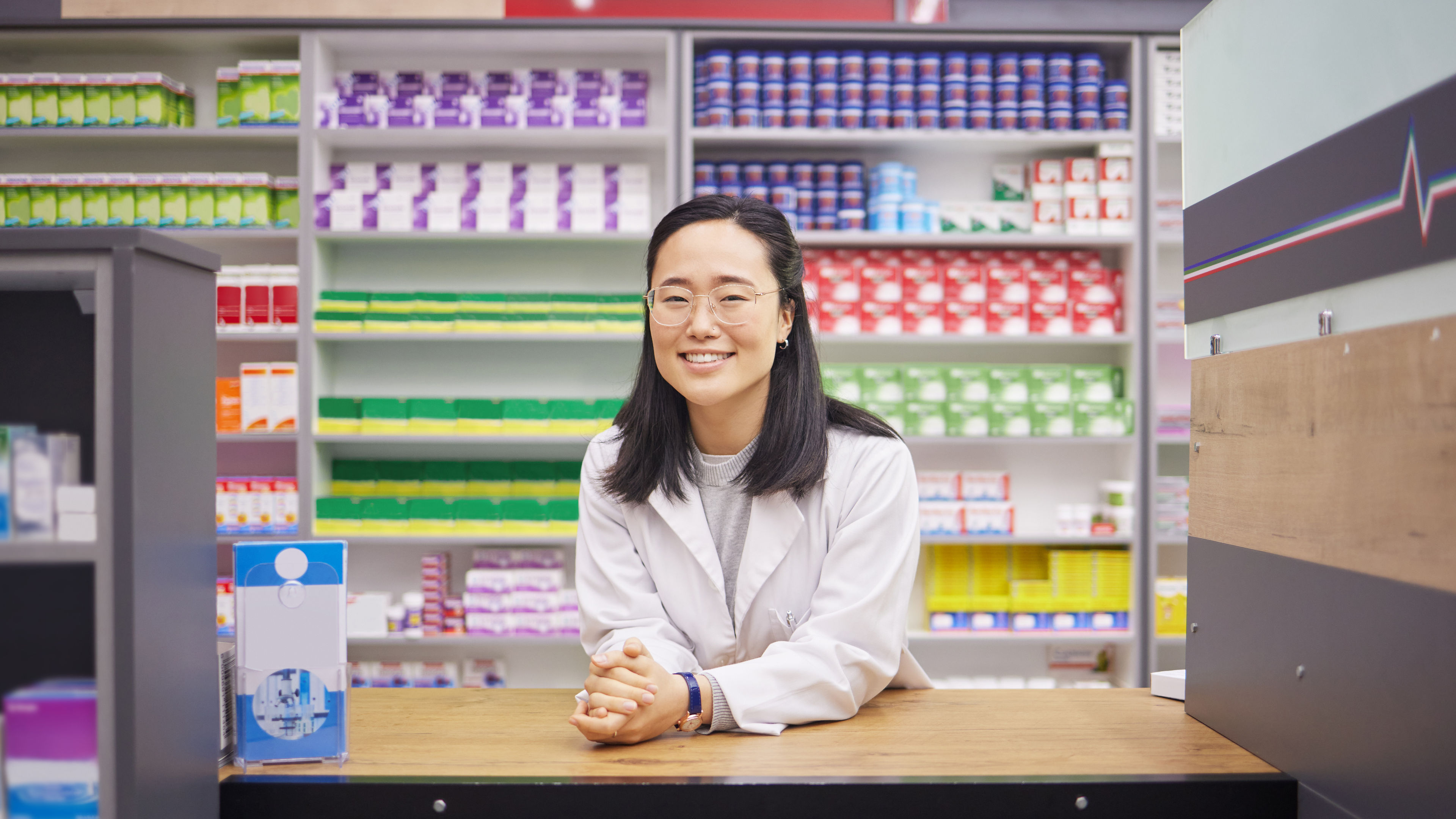A happy woman in a drugstore 