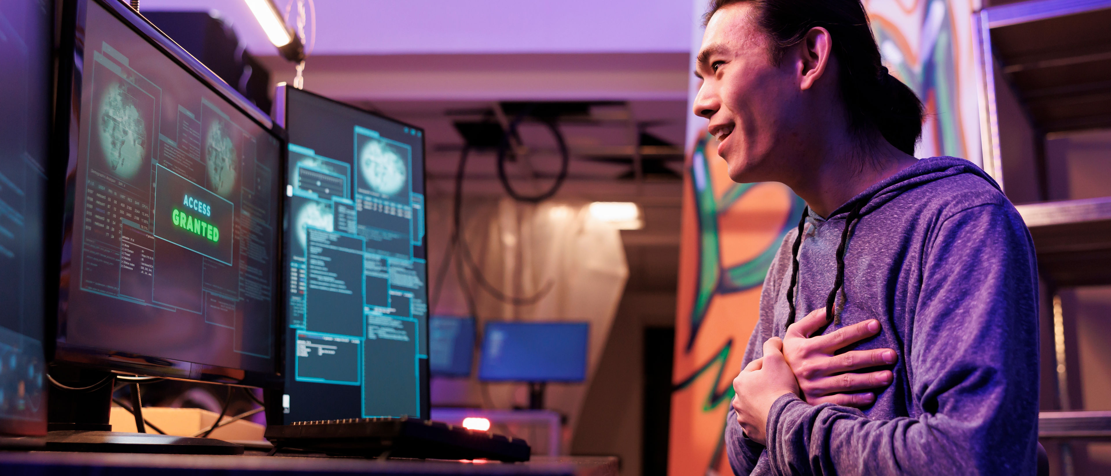 Excited man working with computer