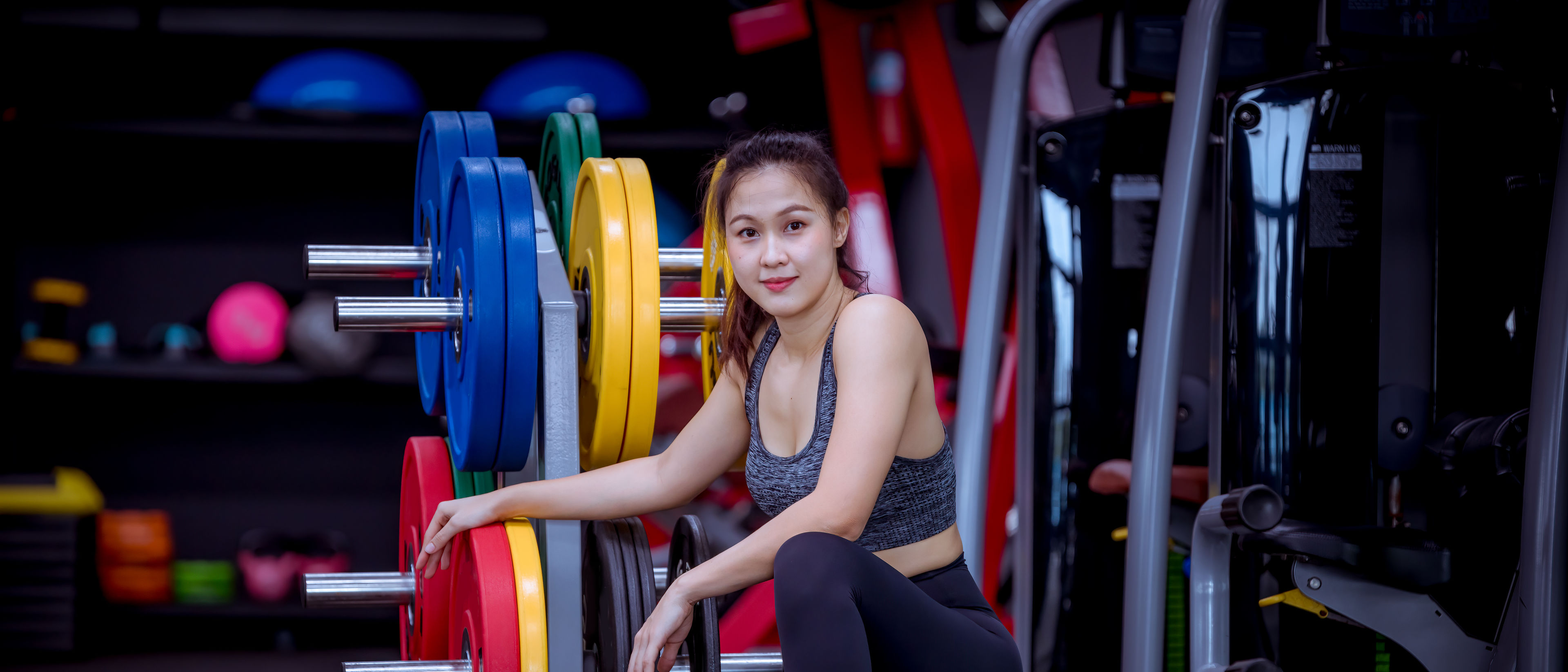 woman with dumbell equipment