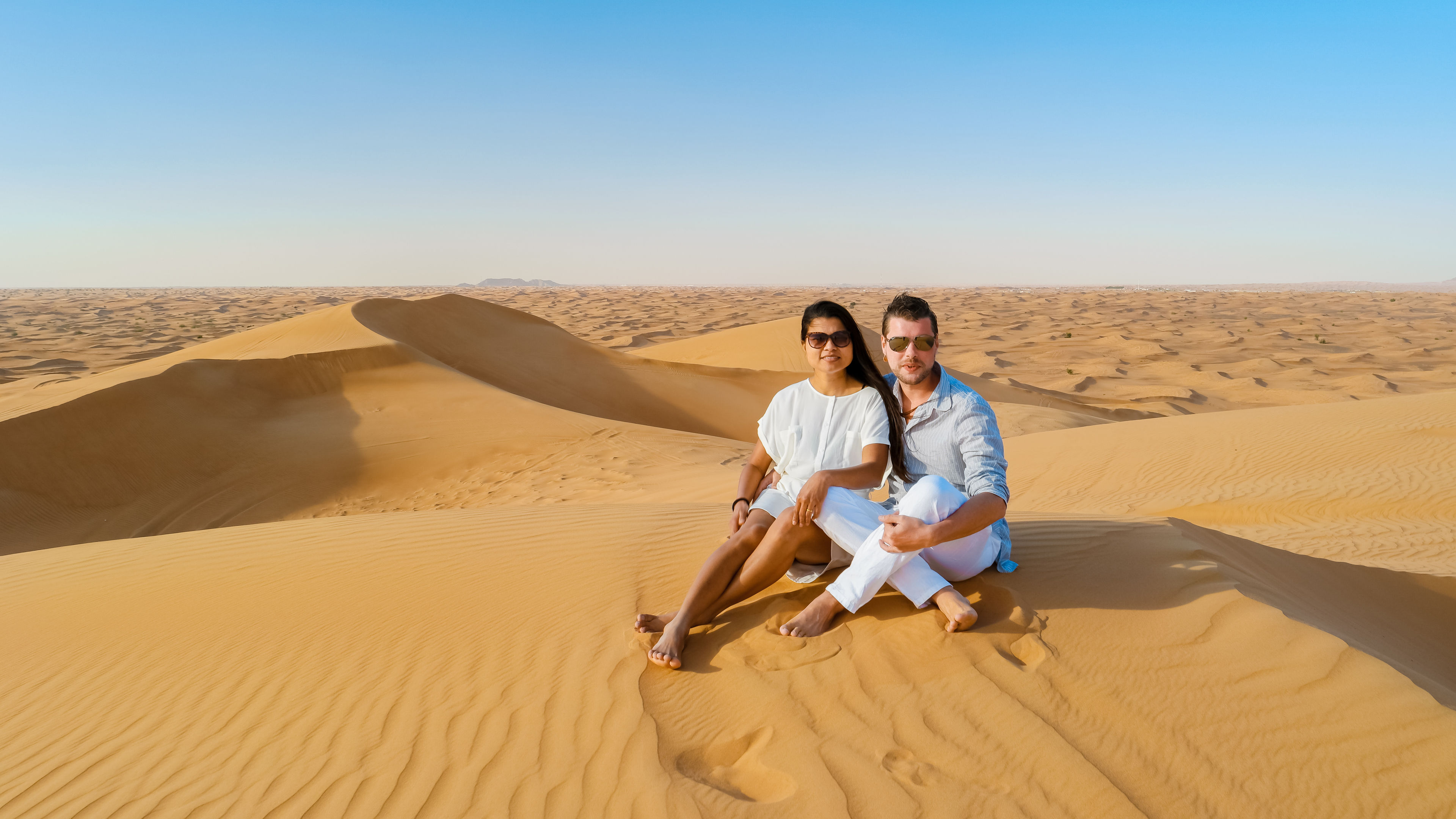 Couple on a Safari trip to the Sand dunes of Dubai United Arab Emirates