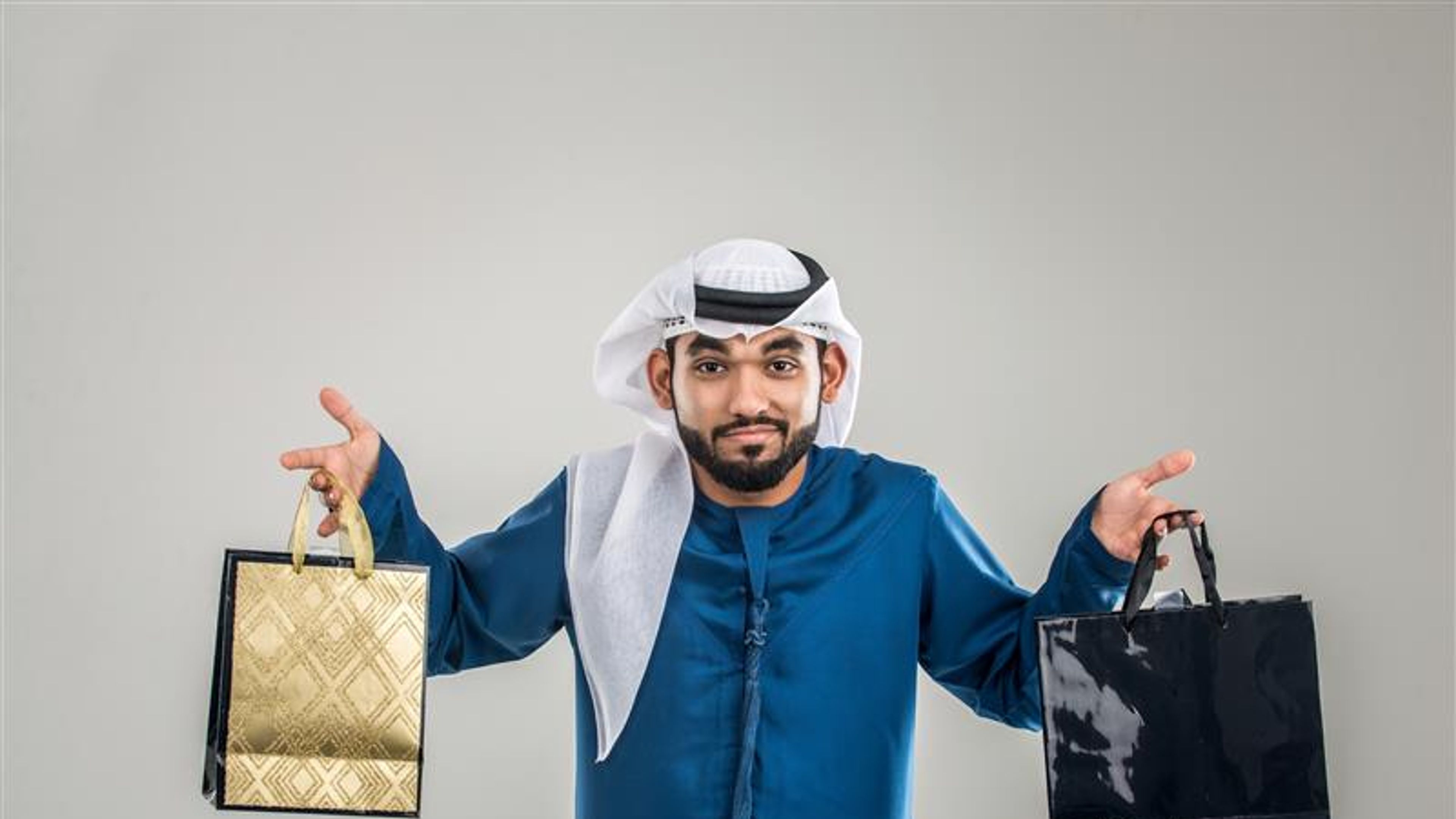 A man with shopping bags in hand 