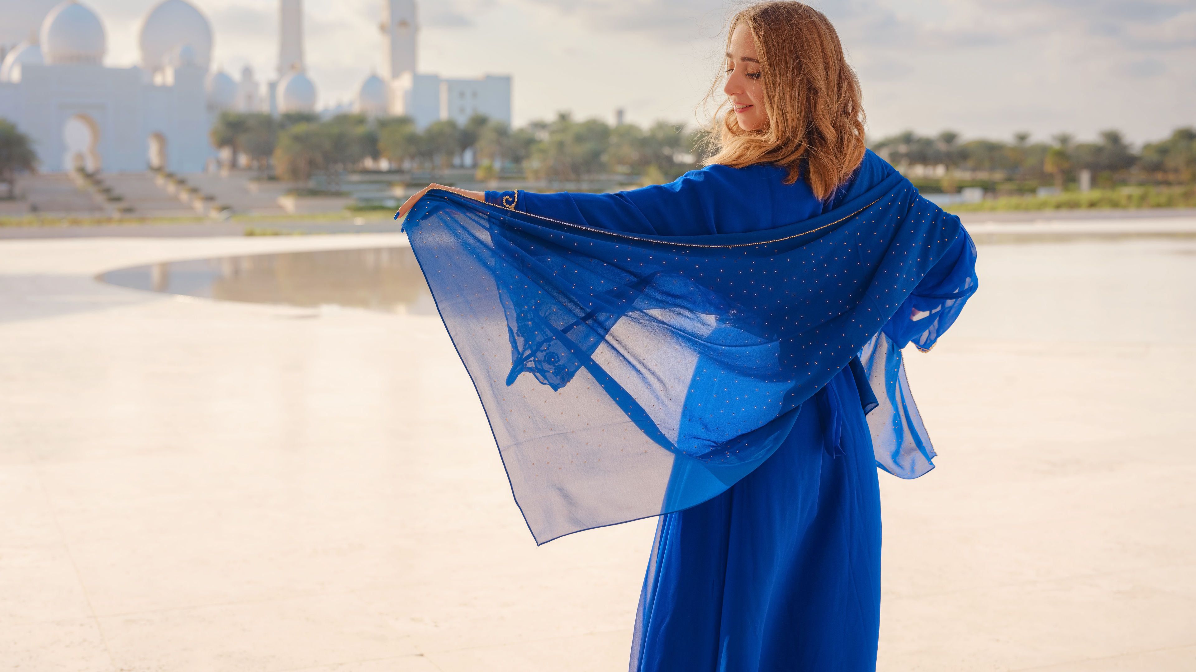 A young woman in a blue Arabian dress 