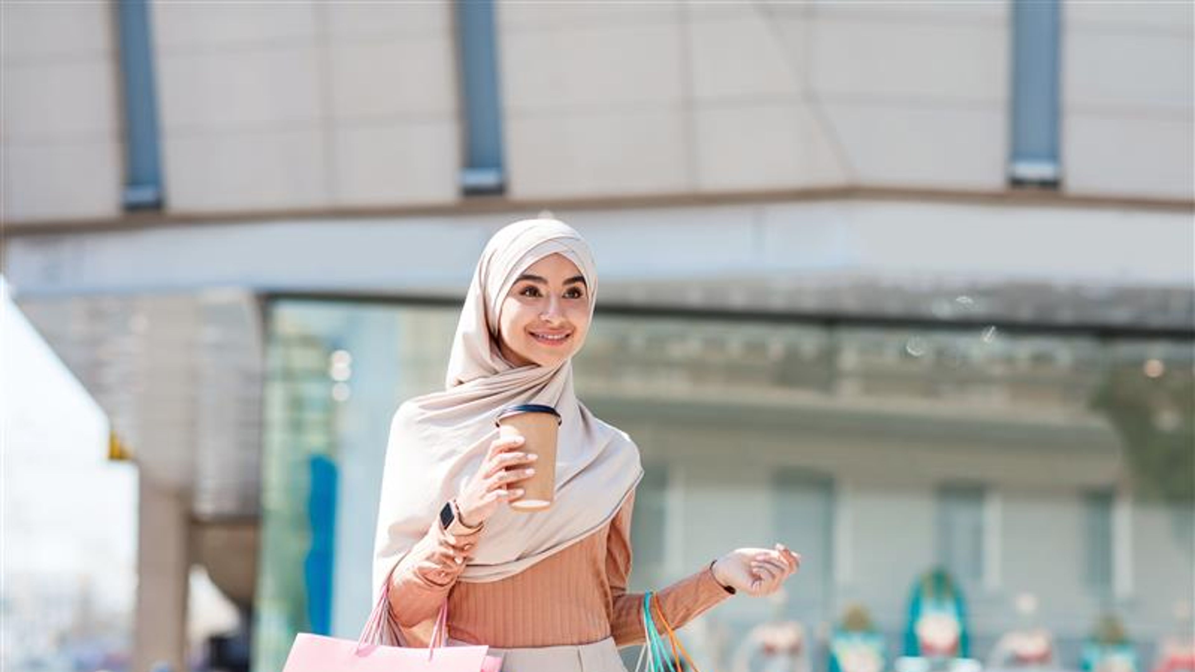 A woman with shopping bags in hand