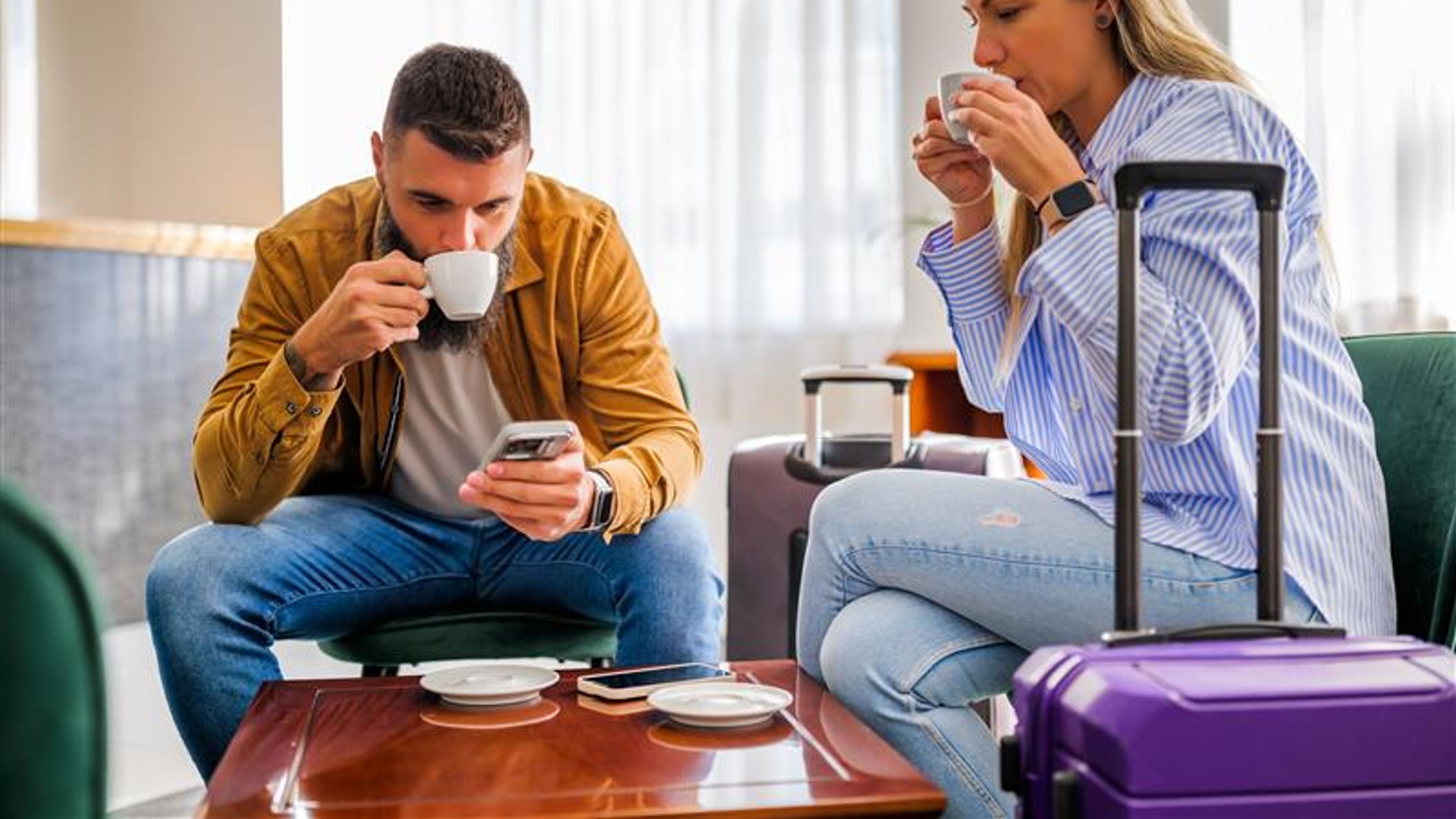 A couple drinking tea in a room 