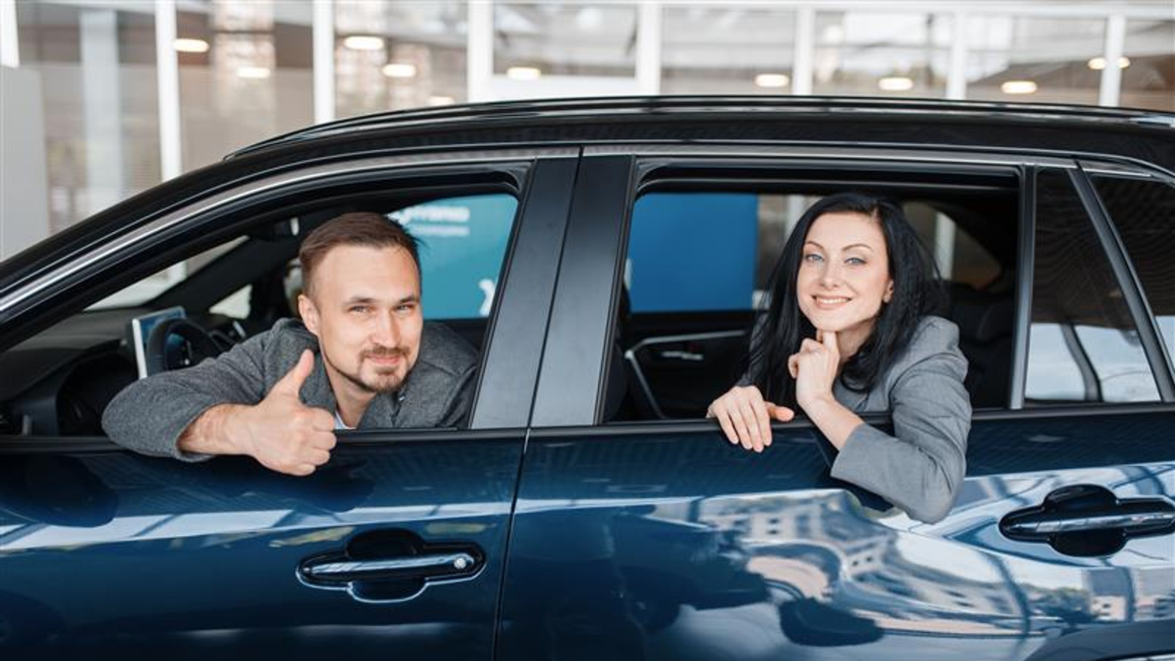 A couple sitting in a car