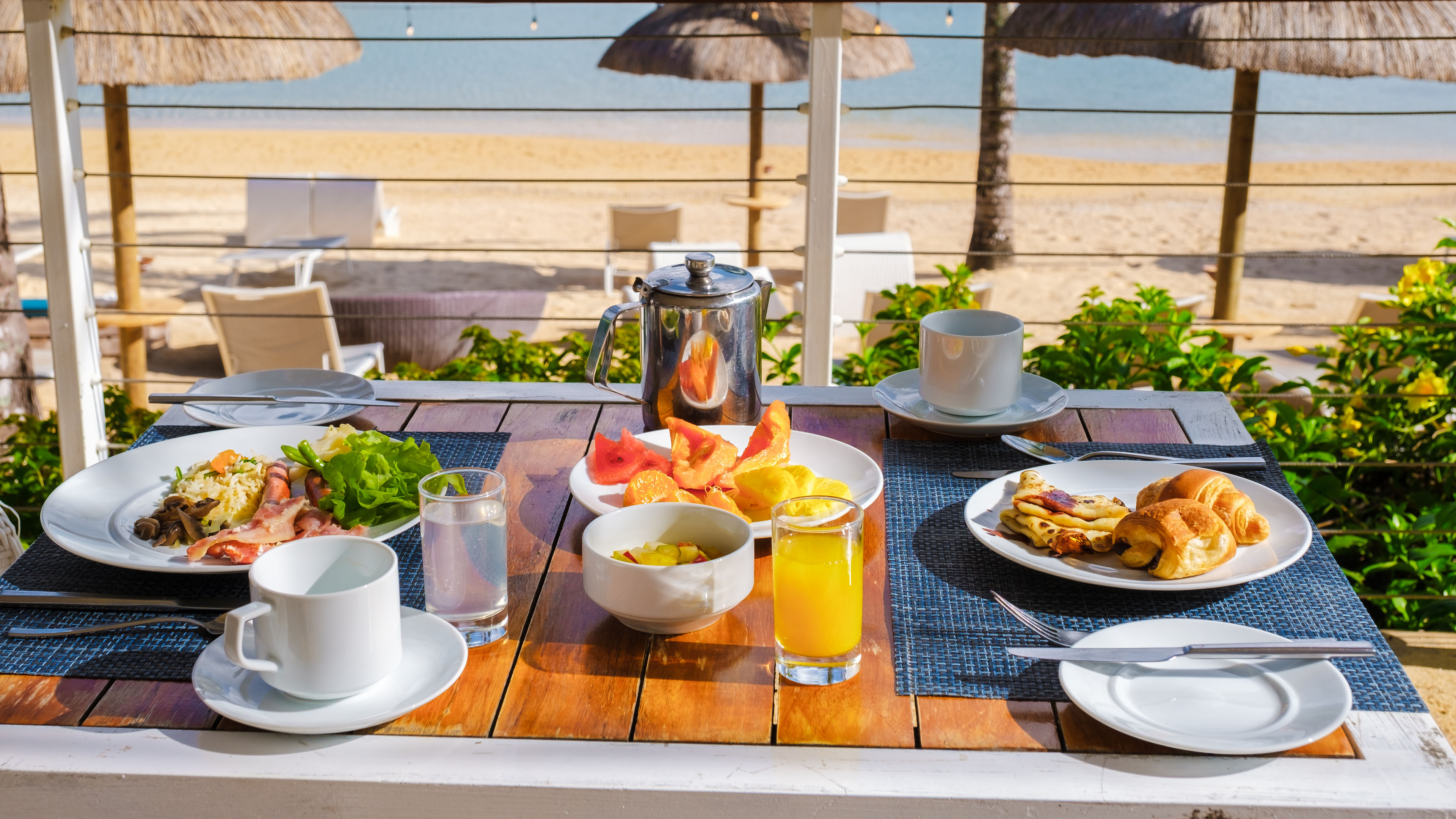 A delicious breakfast is served on a wooden table.  