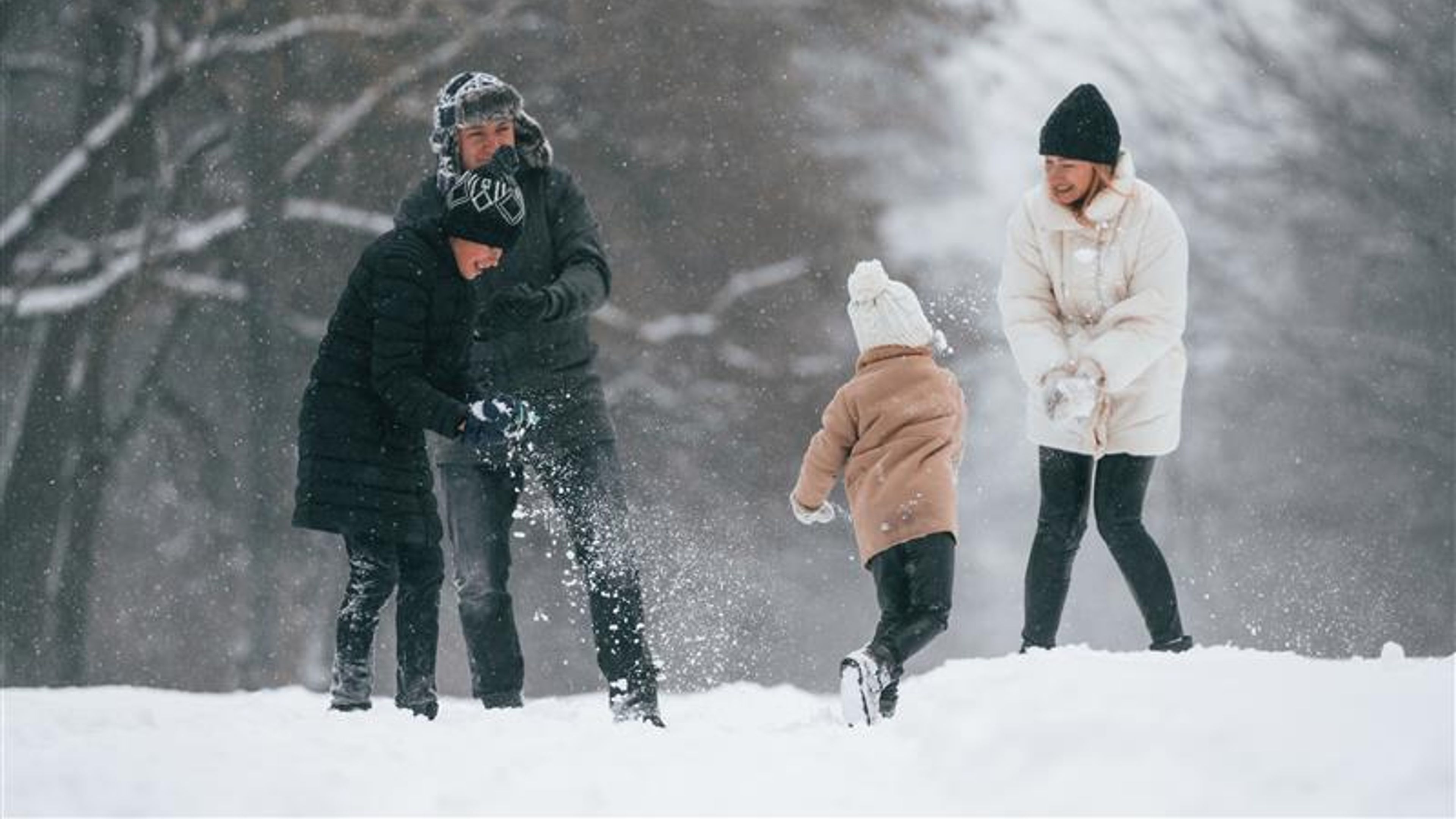 A family enjoying the snow. 